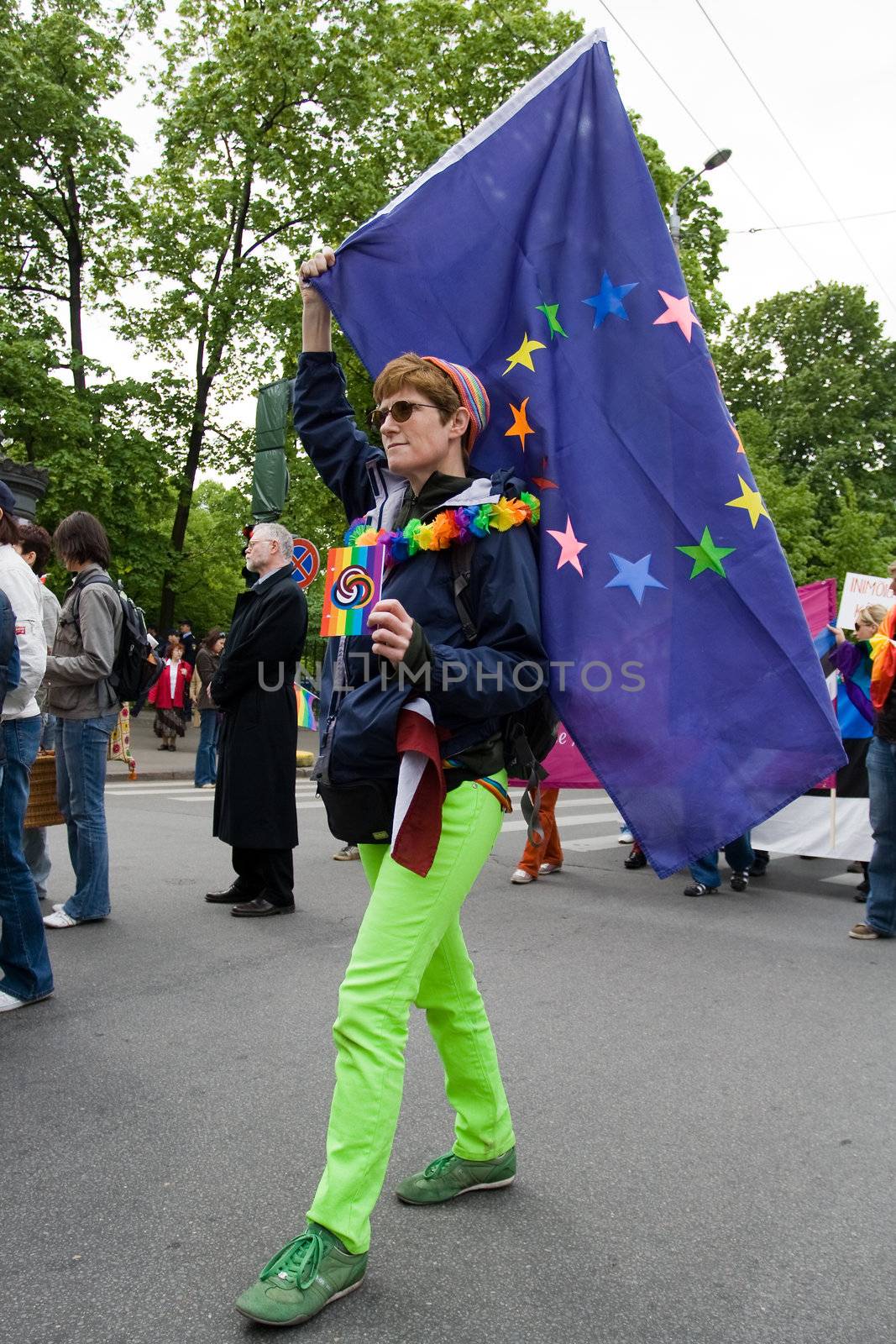 RIGA, LATVIA, MAY 16, 2009: Gay men and women and their supporters at parade in the Latvian capital, accompanied by a strong police presence and loud protest from anti-gay activists.