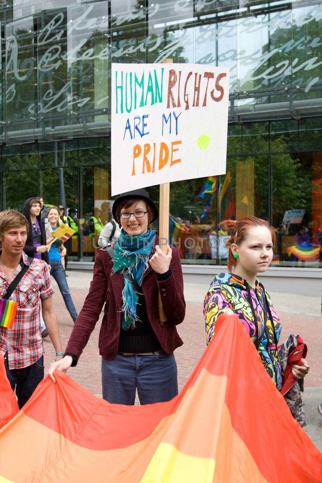 RIGA, LATVIA, MAY 16, 2009: Gay men and women and their supporters at parade in the Latvian capital, accompanied by a strong police presence and loud protest from anti-gay activists.