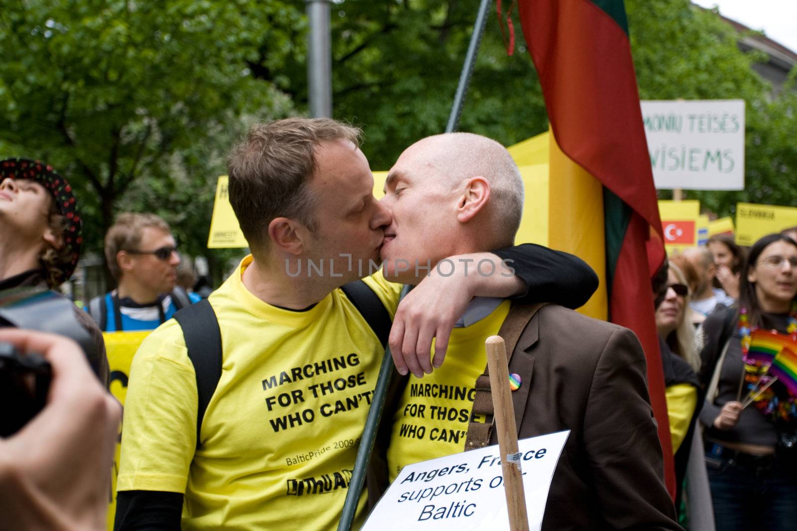 RIGA, LATVIA, MAY 16, 2009: Two men kissing as they take part at Gay and their supporters parade in the Latvian capital, accompanied by a strong police presence and loud protest from anti-gay activists.