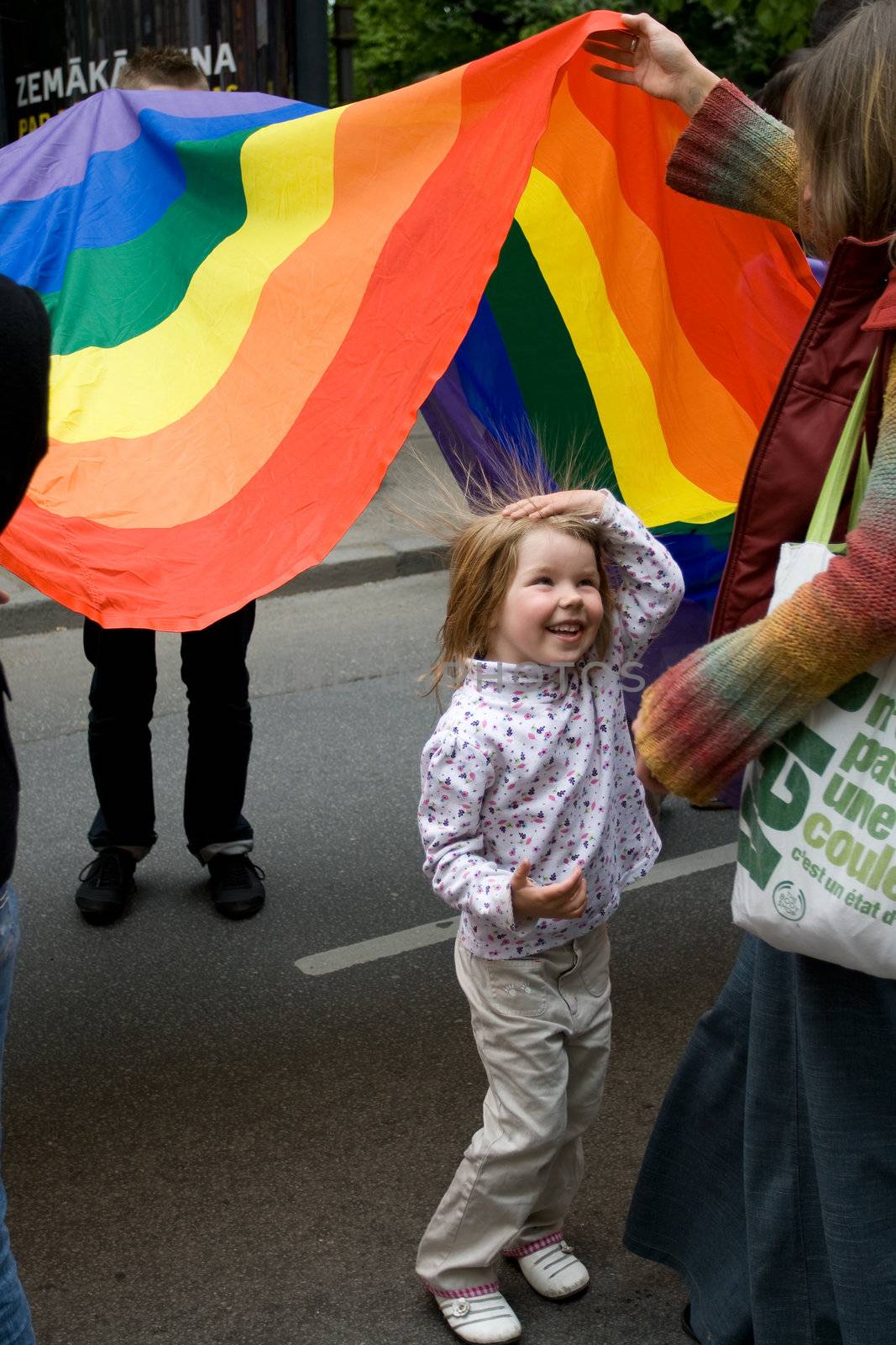 RIGA, LATVIA, MAY 16, 2009: Gay men and women and their supporters at parade in the Latvian capital, accompanied by a strong police presence and loud protest from anti-gay activists.