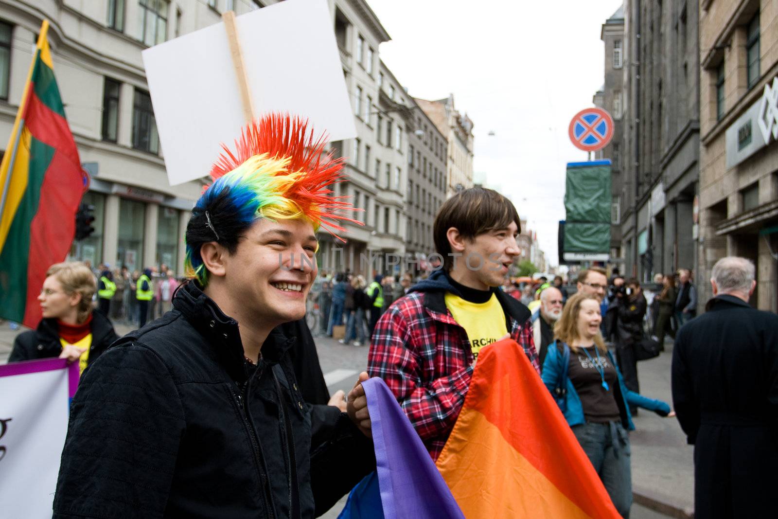 RIGA, LATVIA, MAY 16, 2009: Gay men and women and their supporters at parade in the Latvian capital, accompanied by a strong police presence and loud protest from anti-gay activists.