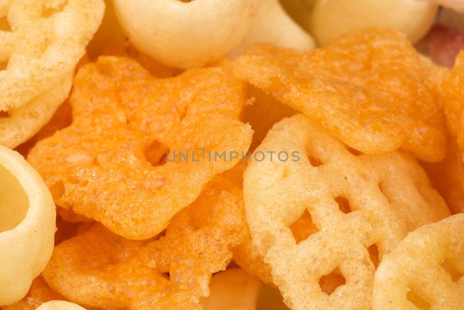 Assortment of various types of snacks, food background