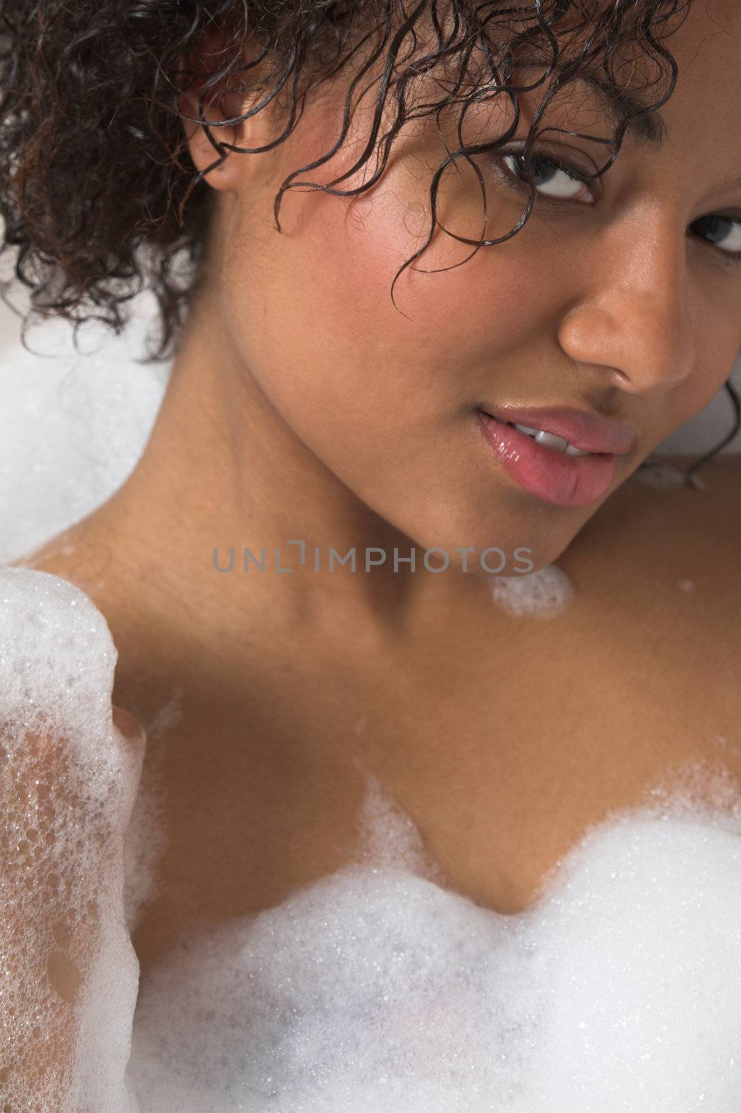 Beautiful woman enjoying a bubble bath