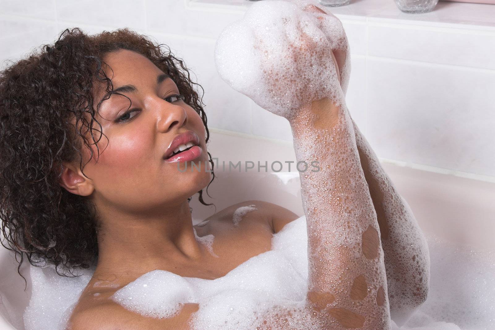 Beautiful woman taking a bubble bath
