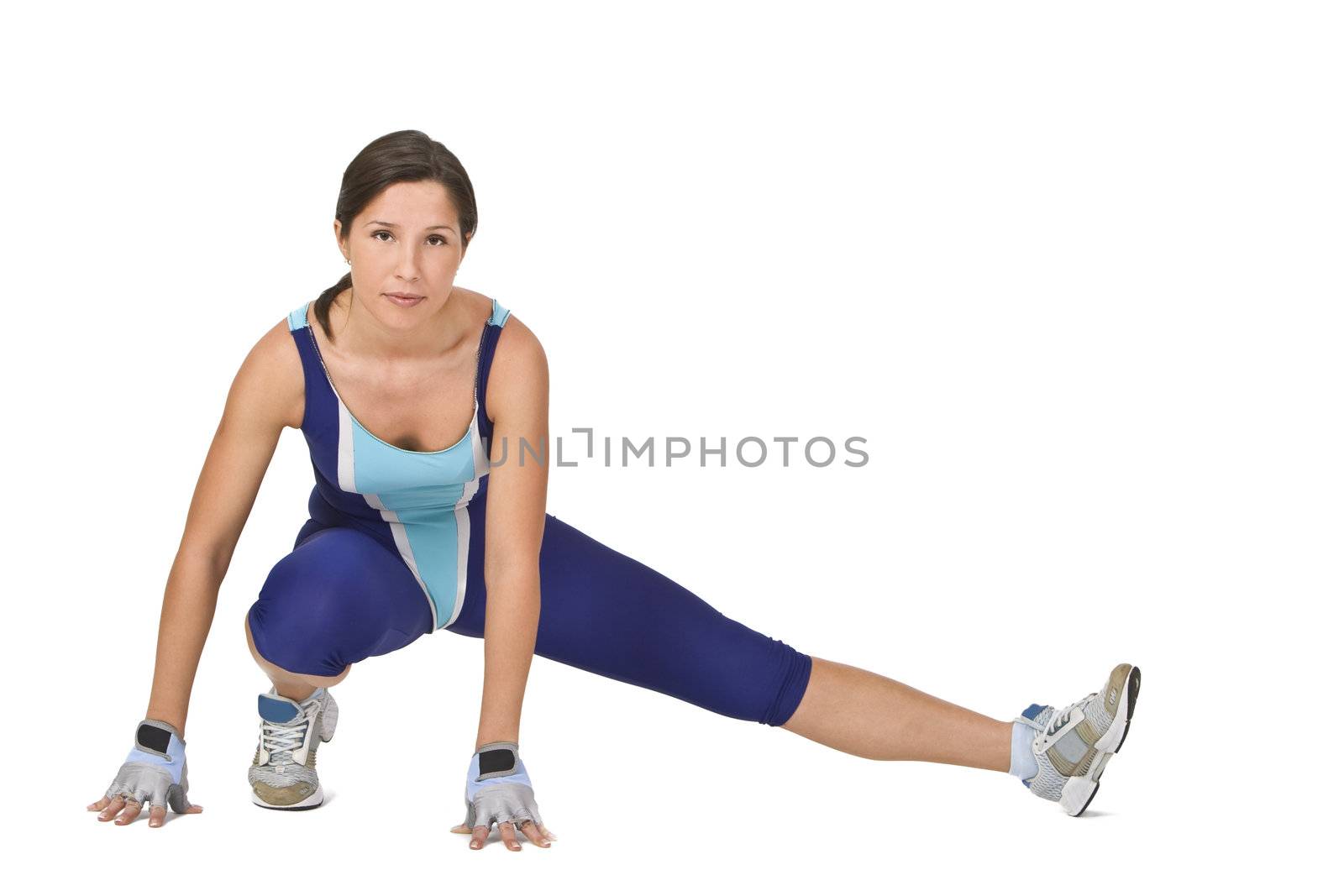 Fitness girl doing stretching movements during the exercise training.