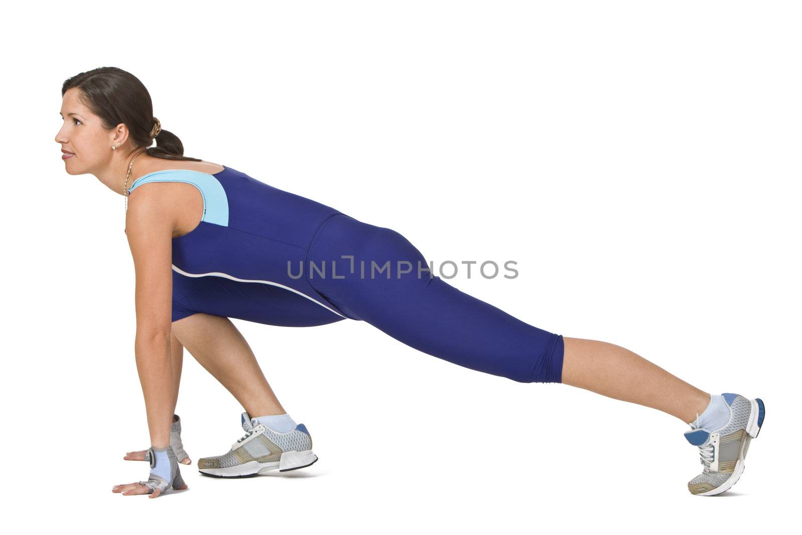 Young woman doing a lunge during a fitness exercise.