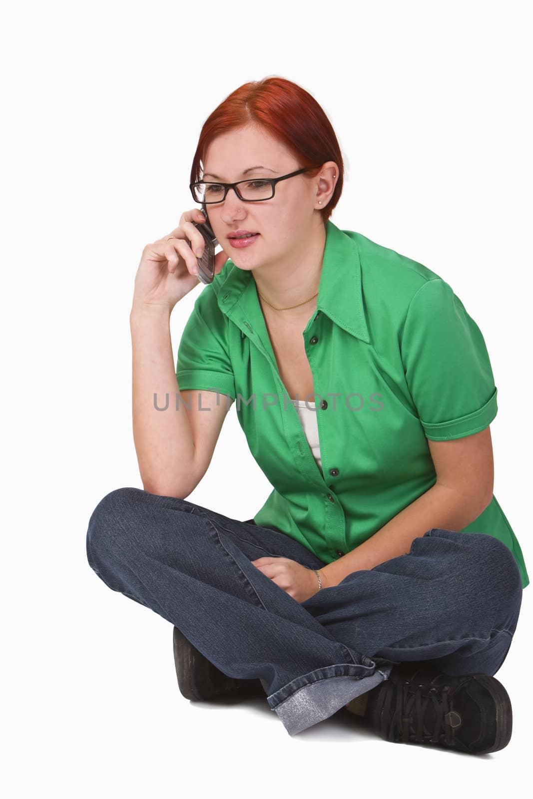 Image of a redheaded teenager girl using a mobile phone.Shot with Canon 70-200mm f/2.8L IS USM