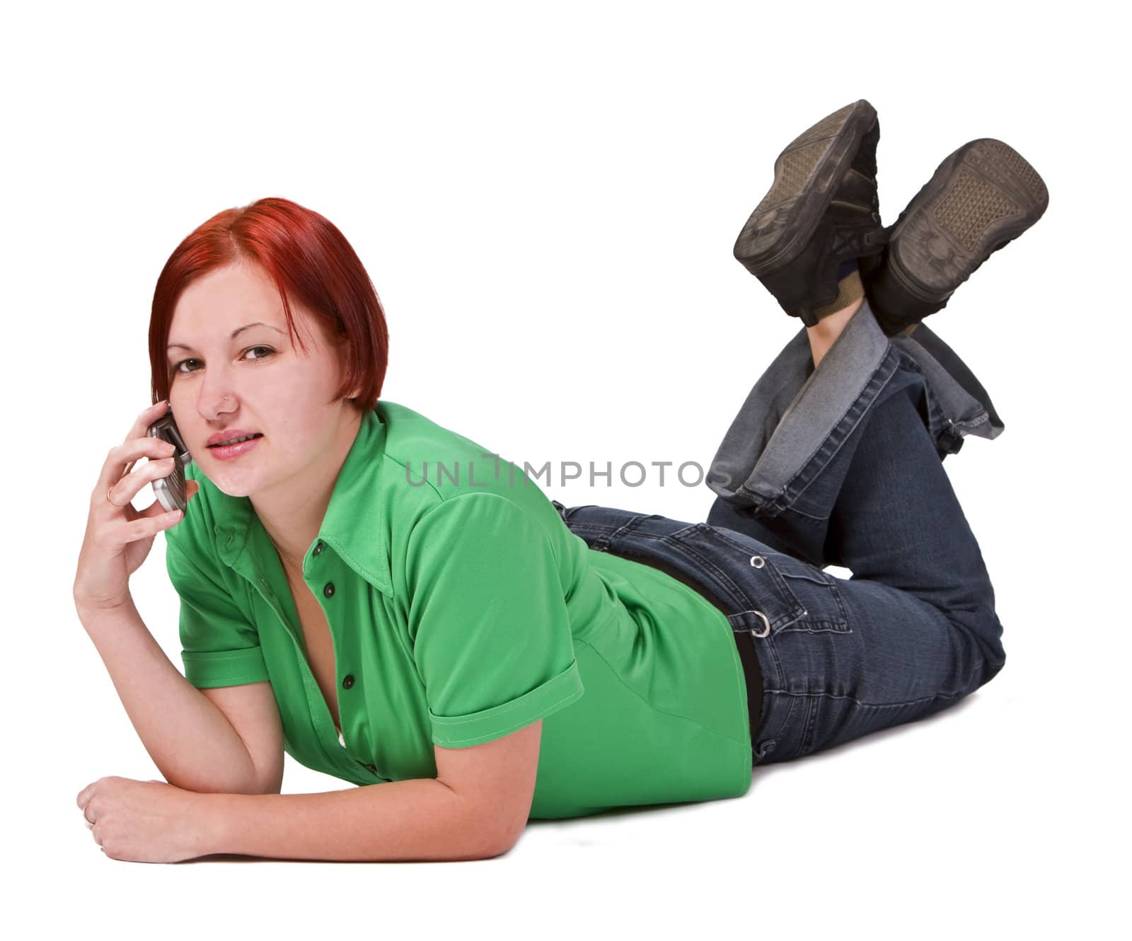 Redhead teenager lying down and talking on a mobile phoneShot with Canon 70-200mm f/2.8L IS USM