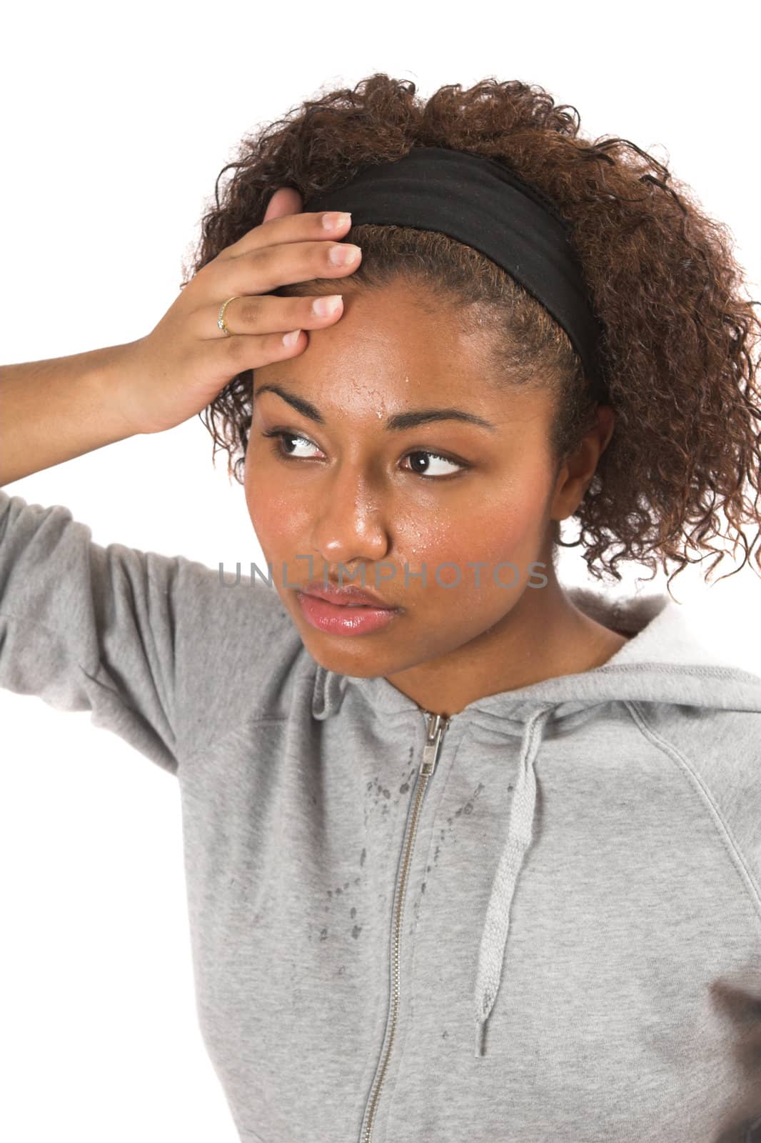 Beautiful black woman wiping the sweat of her forehead