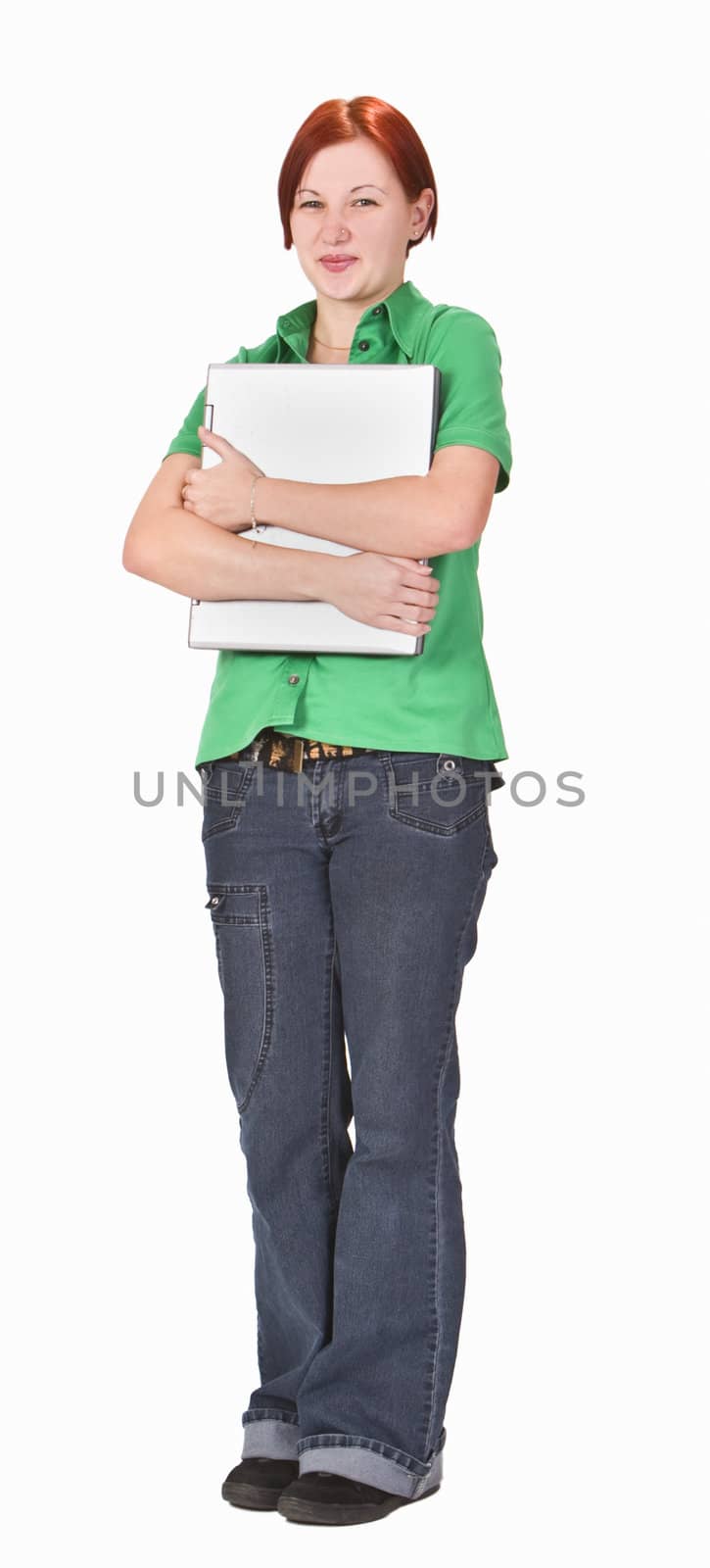 Redheaded girl student hugging her laptop. 