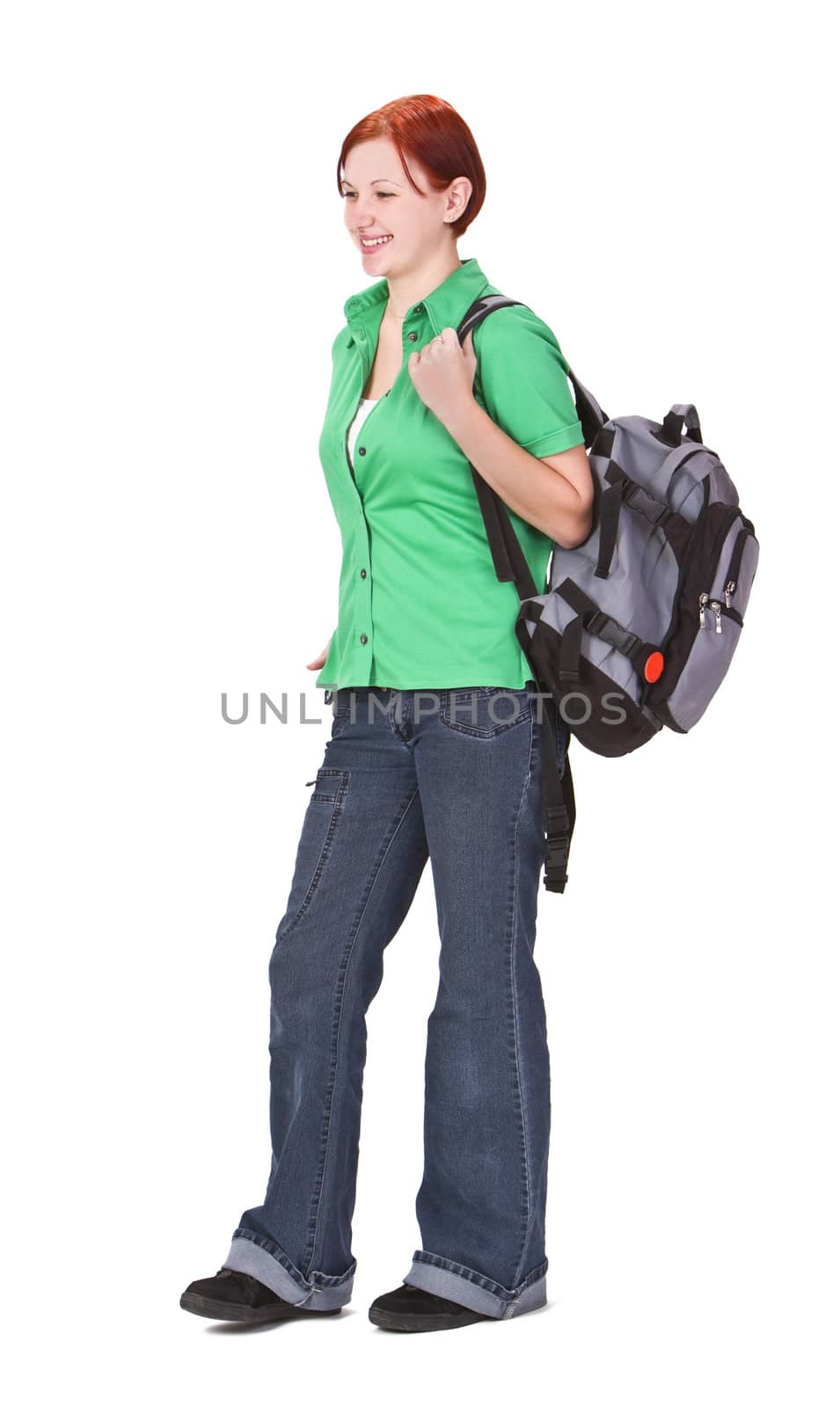 Redheaded teenage backpacker against a white background.