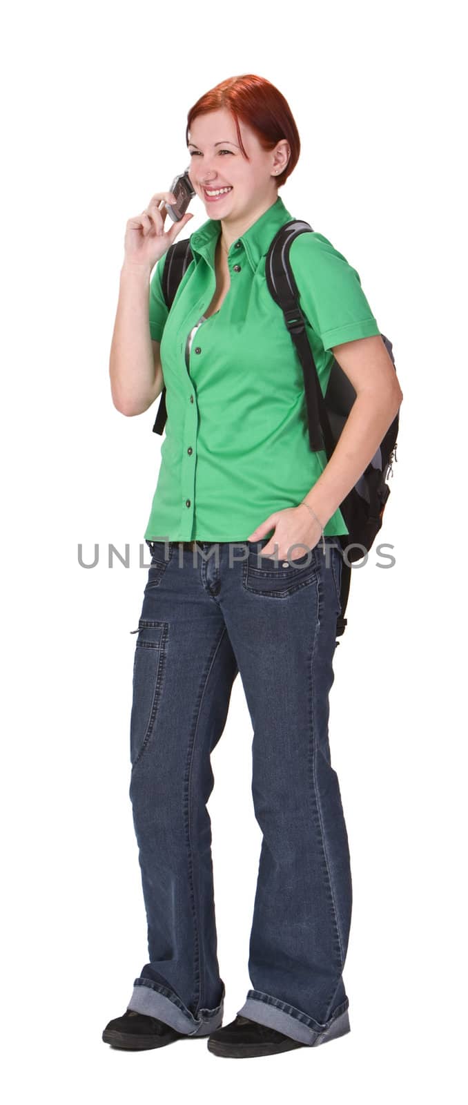 Happy young teenage girl talking on a mobile phone.