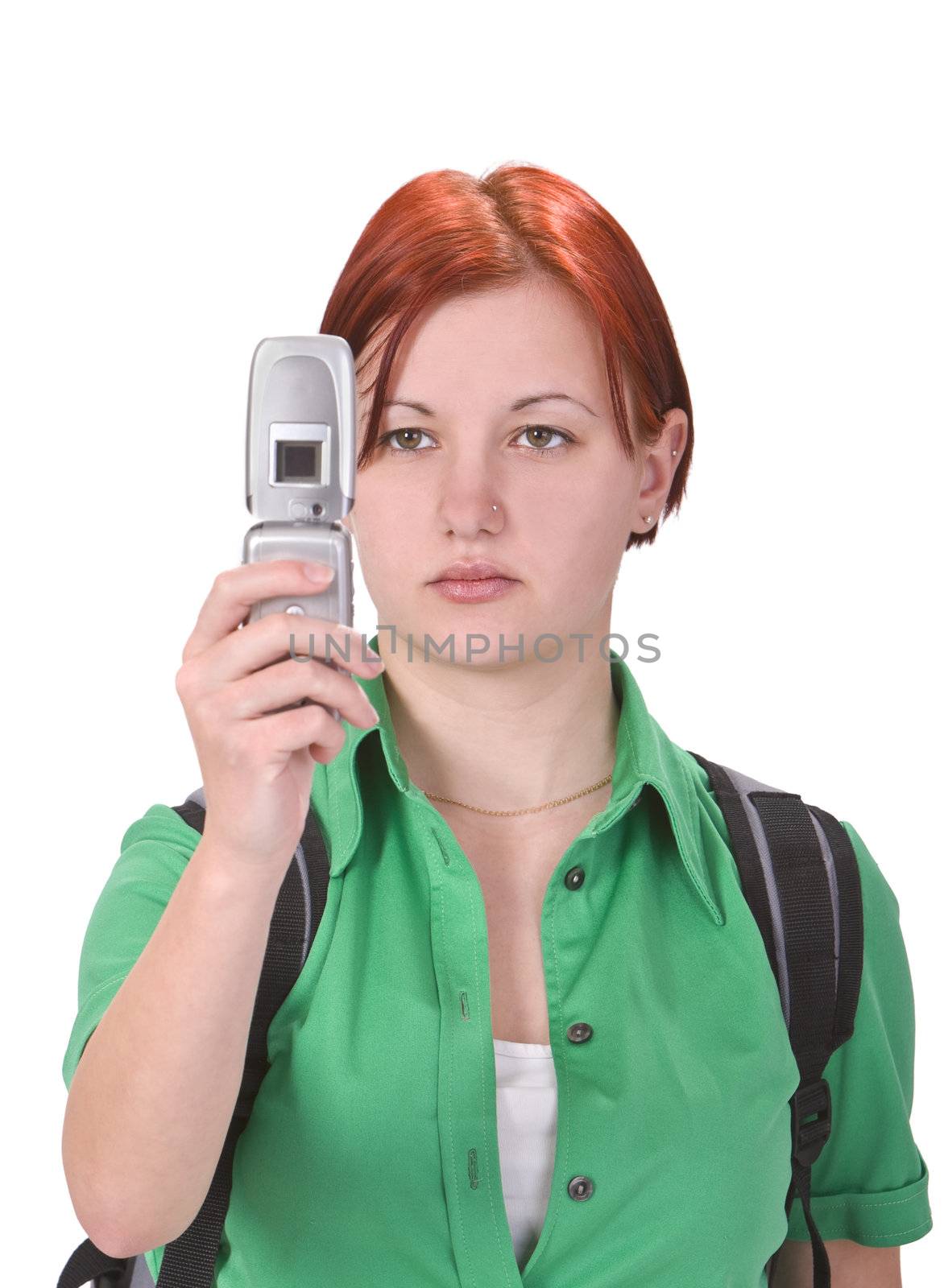 Image of a redheaded teenager taking photos with a mobile phone camera. The main focus is on her face.Shot with Canon 70-200mm f/2.8L IS USM