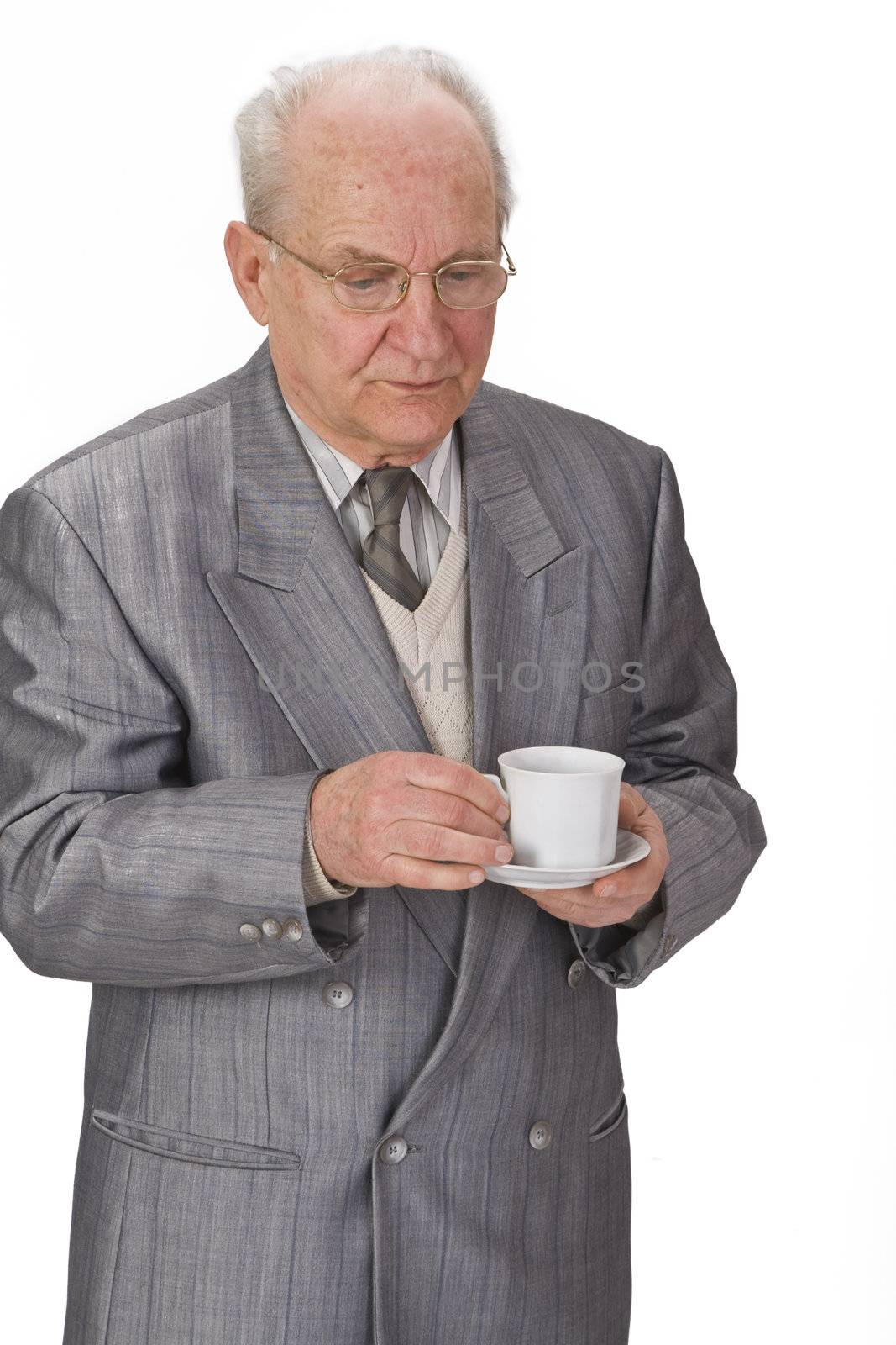 Senior man with a cup of tea.Shot with Canon 70-200mm f/2.8L IS USM