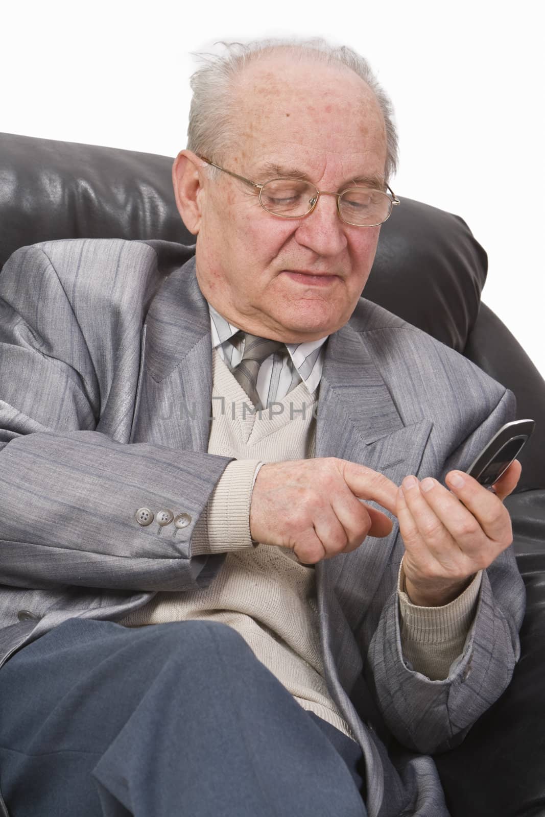 Close-up image of a senior man typing a message on his mobile phone.Shot with Canon 70-200mm f/2.8L IS USM