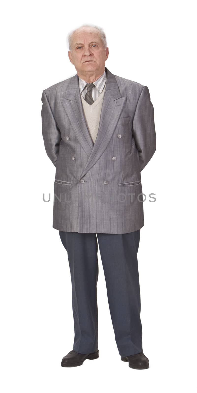 Senior man standing up against a white background.