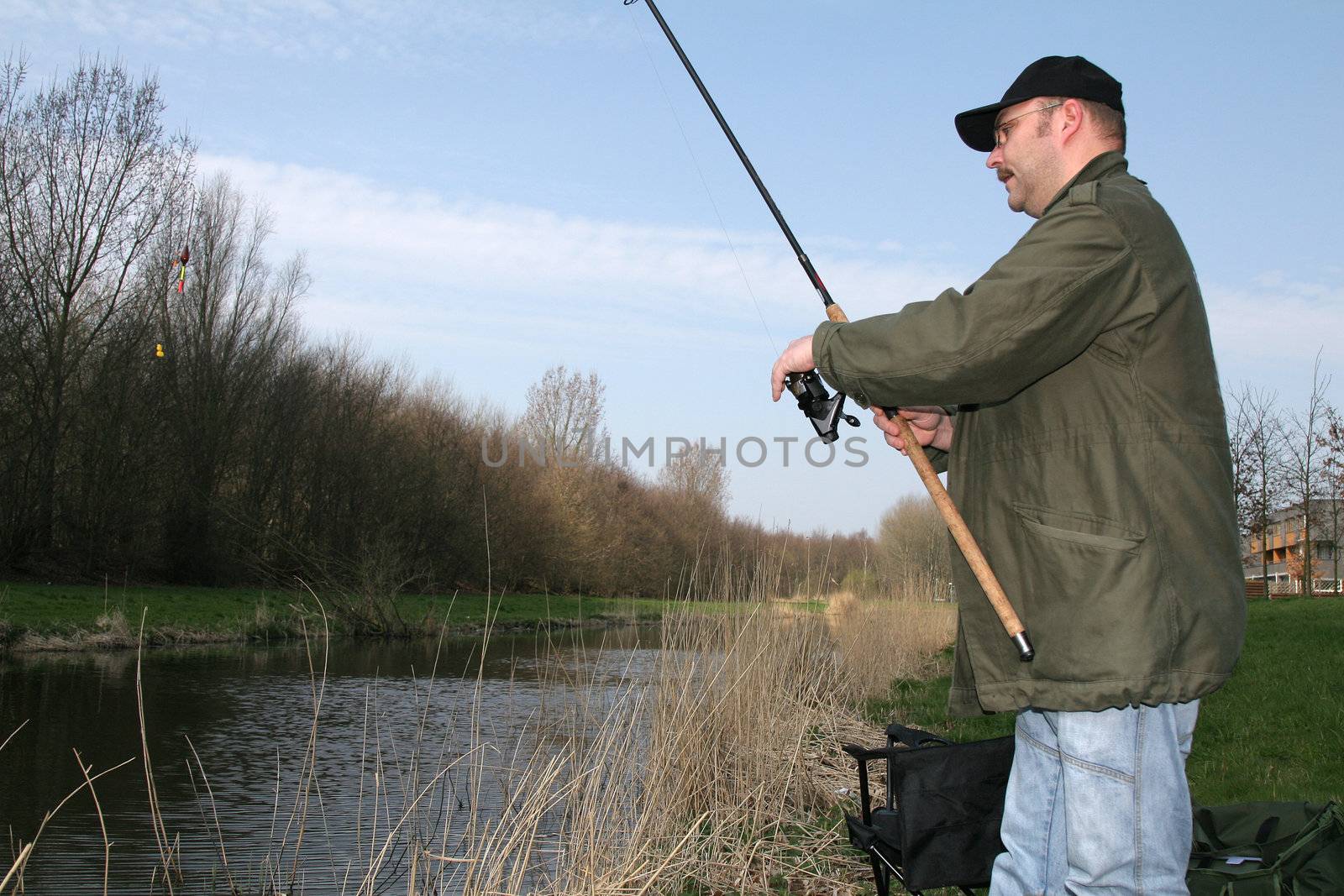 Man throwing out his fishing rod