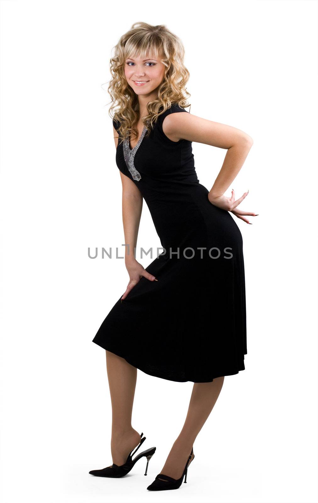 Young friendly blond woman in black dress on isolated background