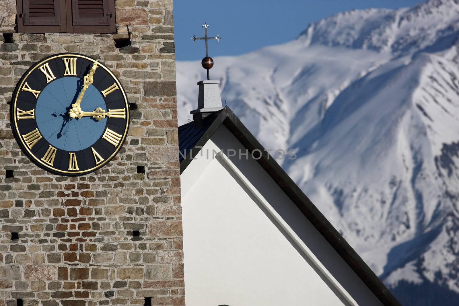 Detail view of a clock on a church tower by monner