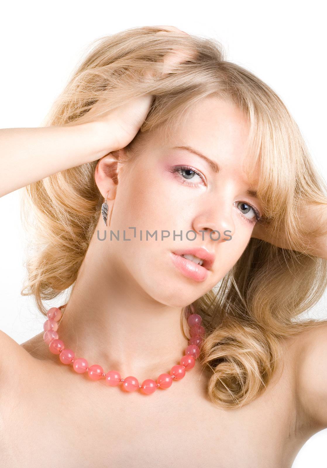 Close-up portrait of young sexy woman with beads