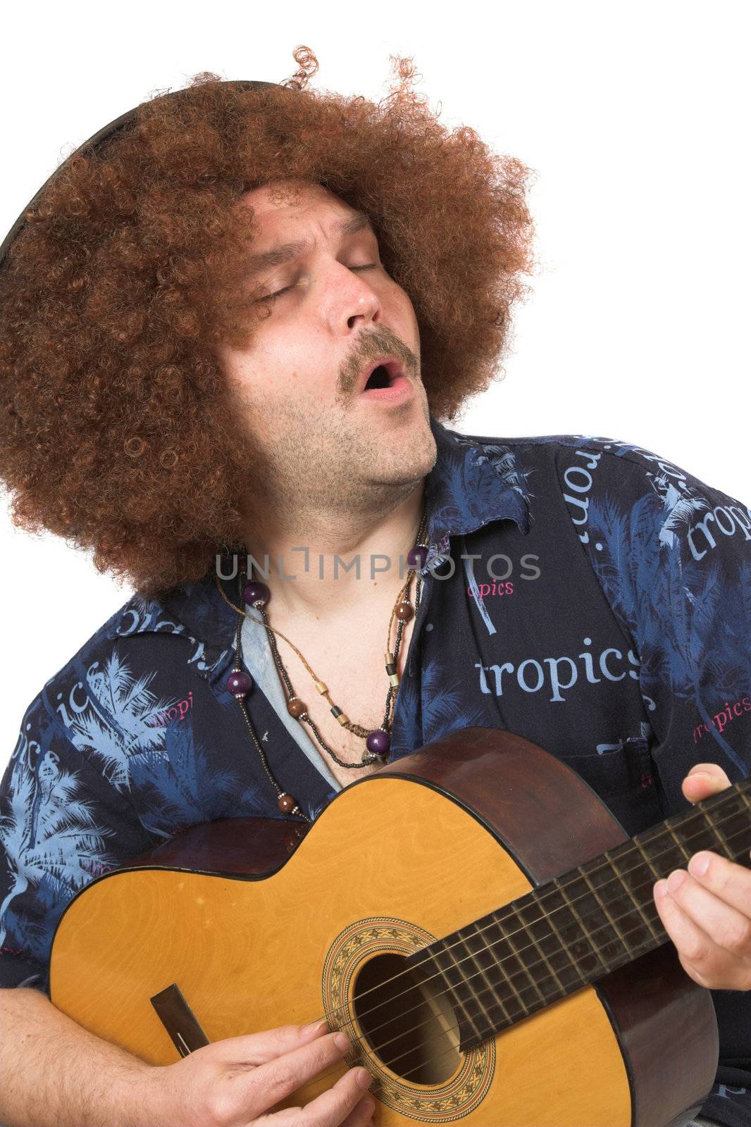 Hippie singing along with his guitar