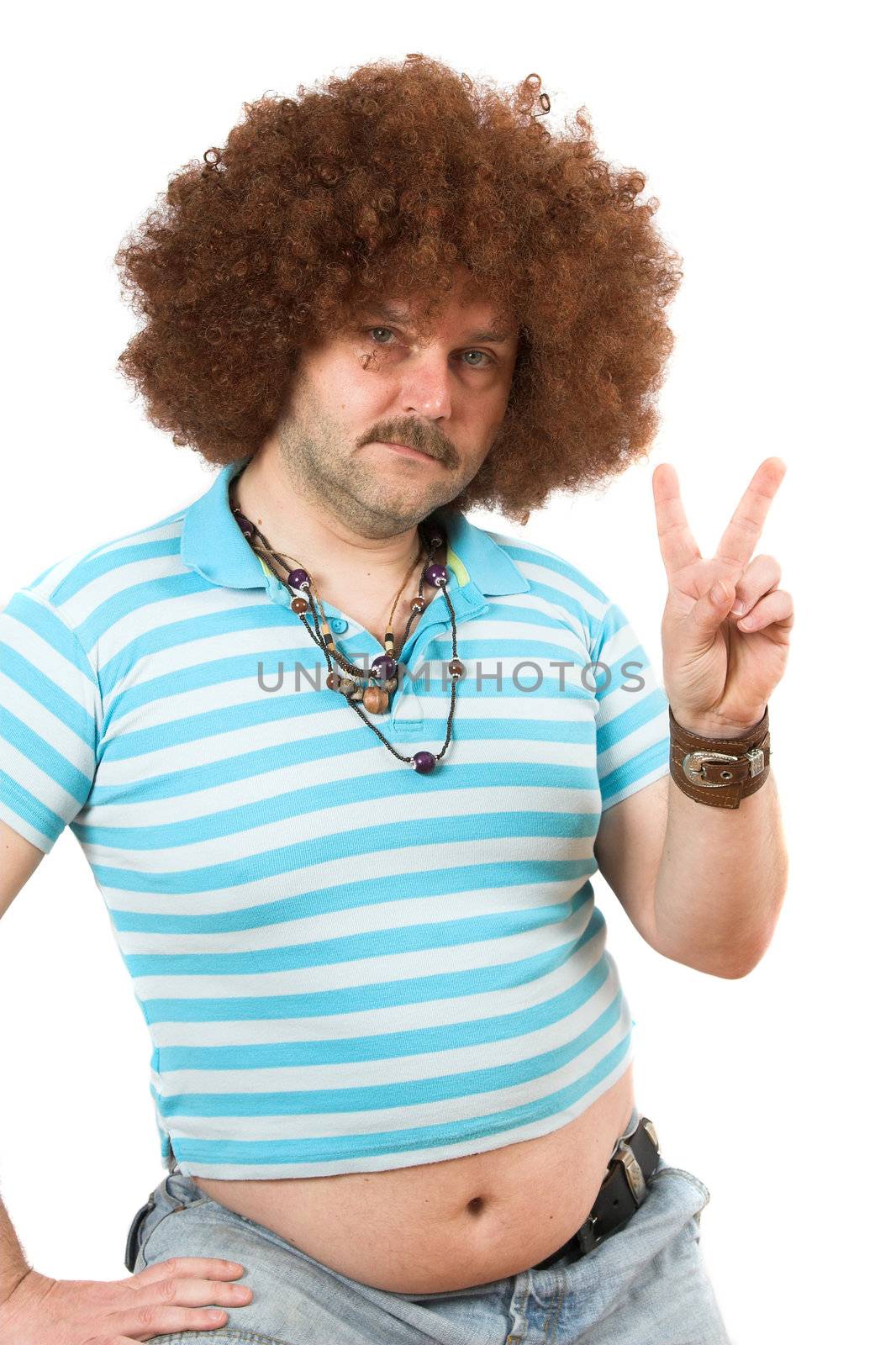 Old hippie with beerbelly hanging over his jeans making the peace sign