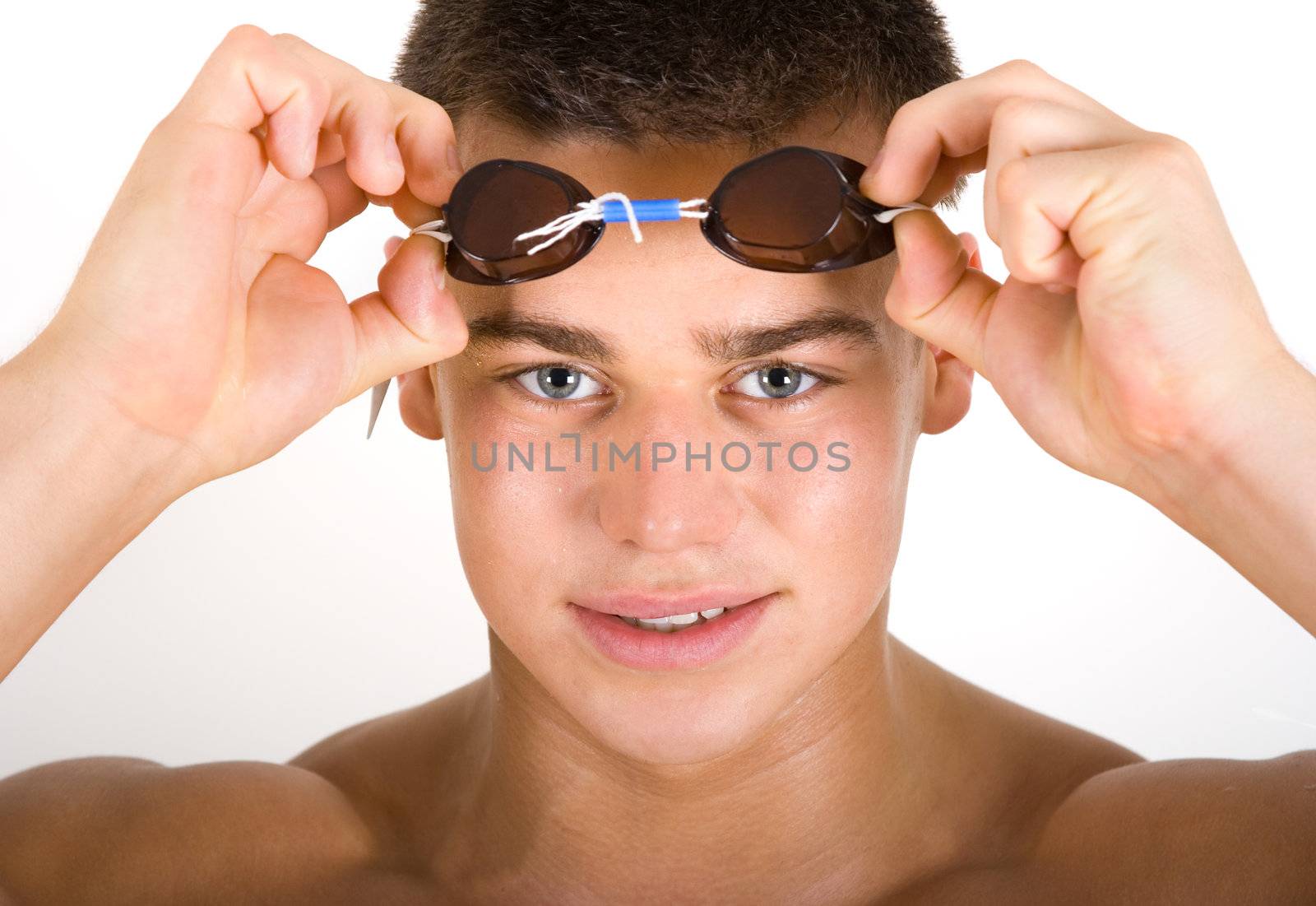 Young male swimmer with swimming glasses