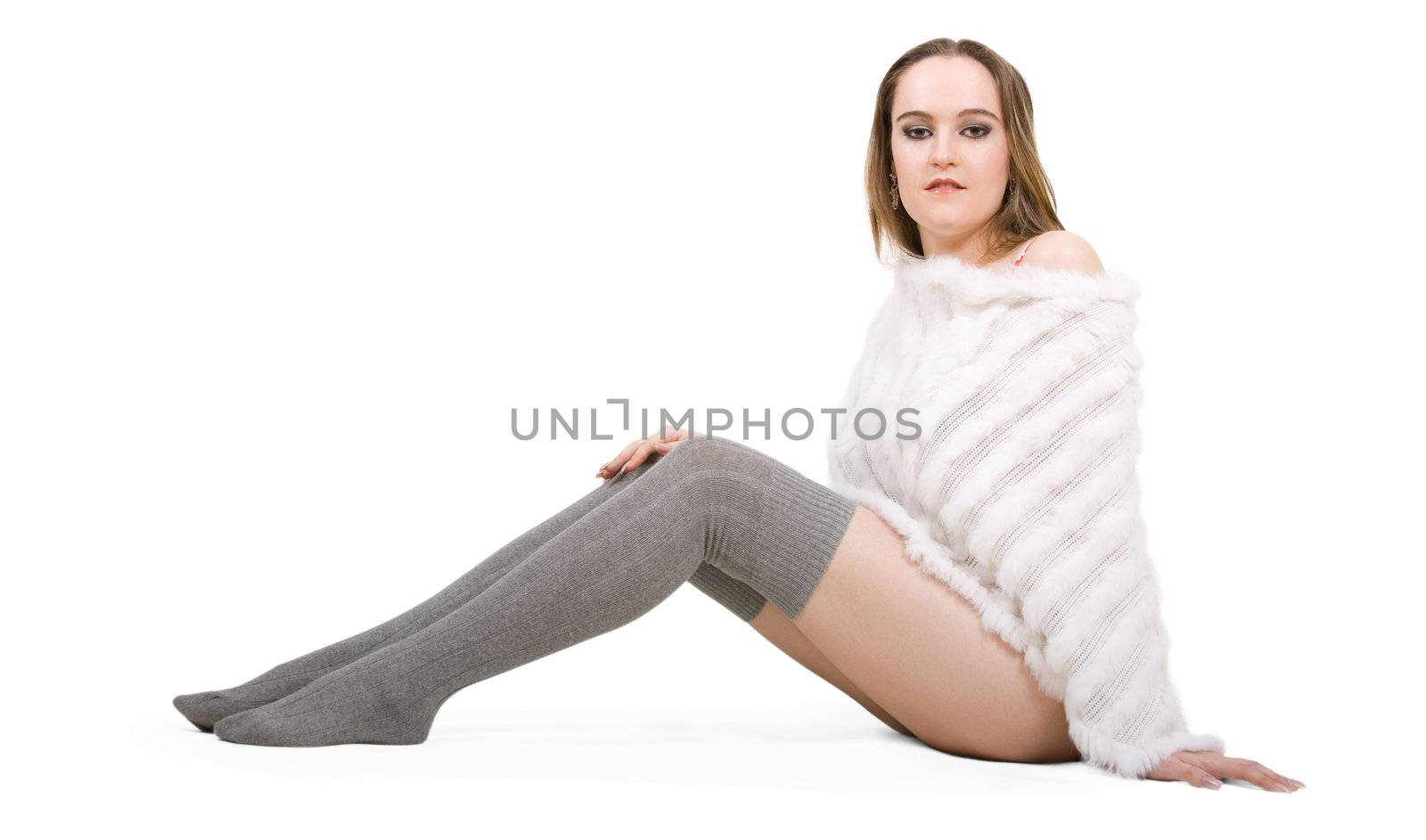 Young friendly woman in white fur poncho on isolated background