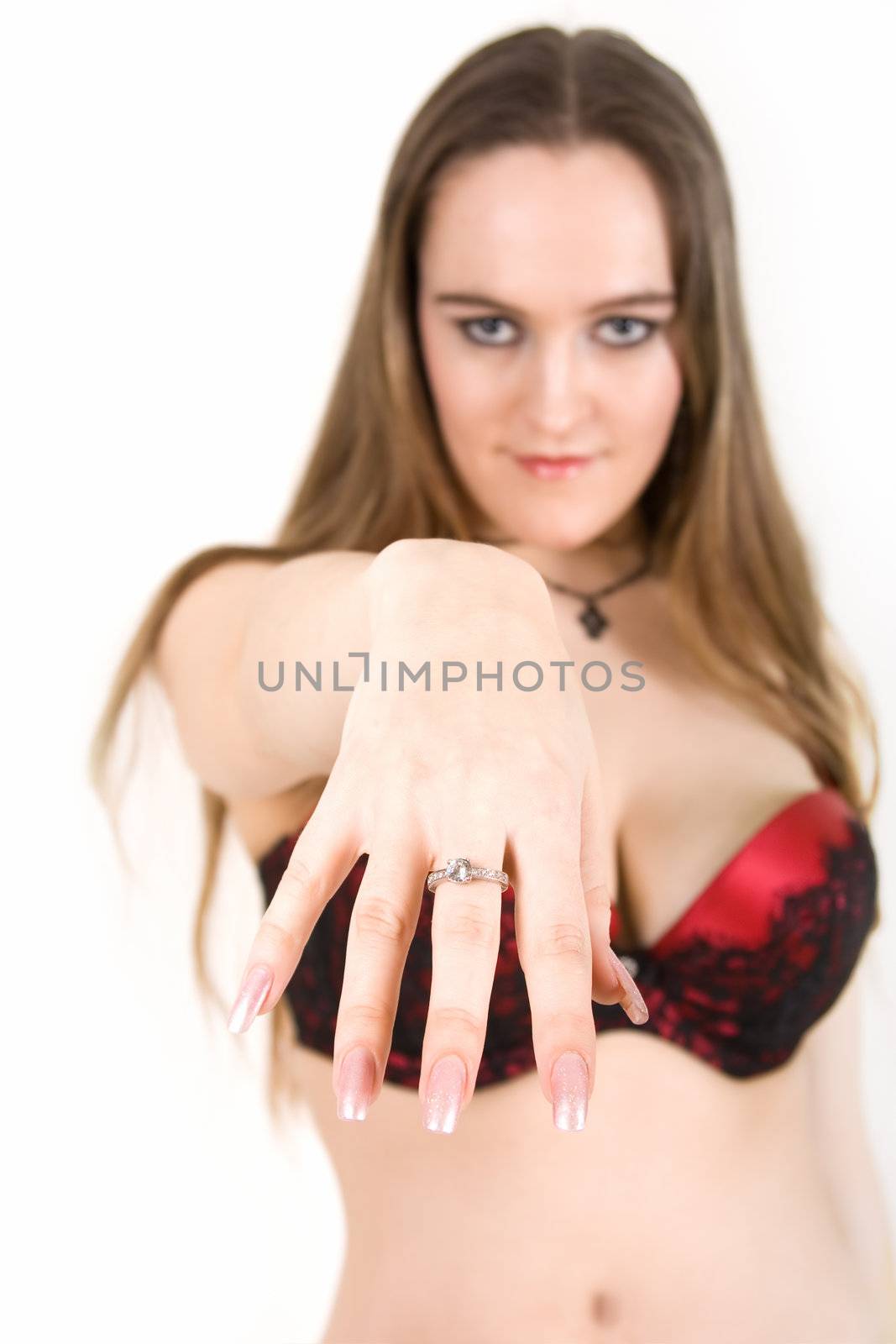 Happy young girl showing a wedding ring