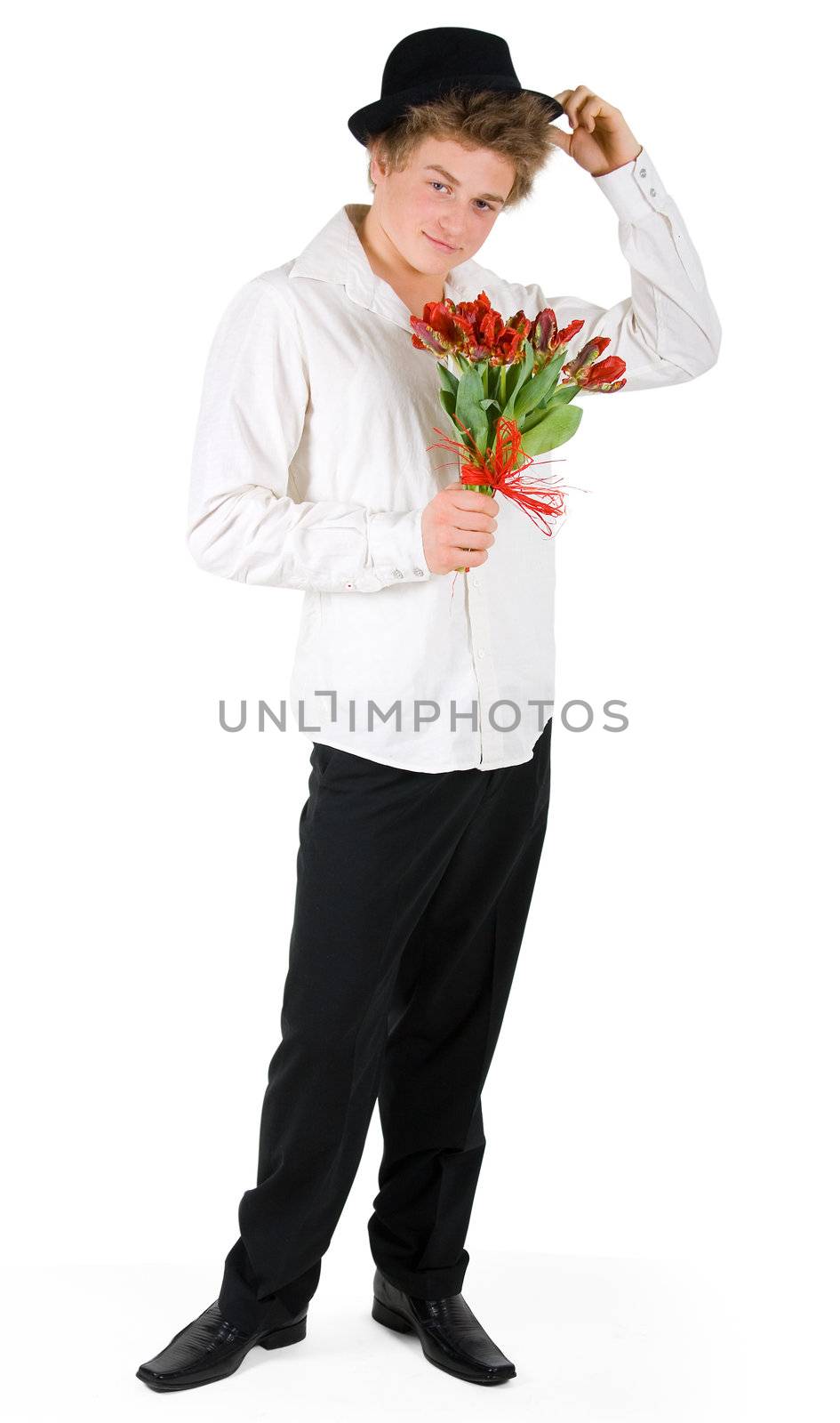 Shy handsome boy with bouquet of tulips