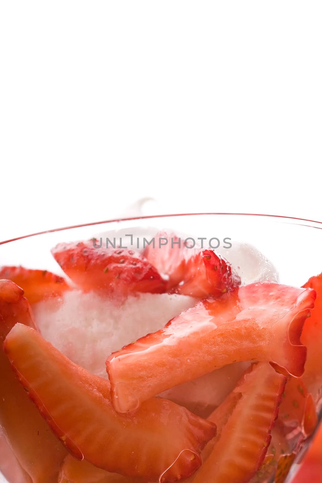 Strawberry shortcake in a martini glass sponge cake and whip cream