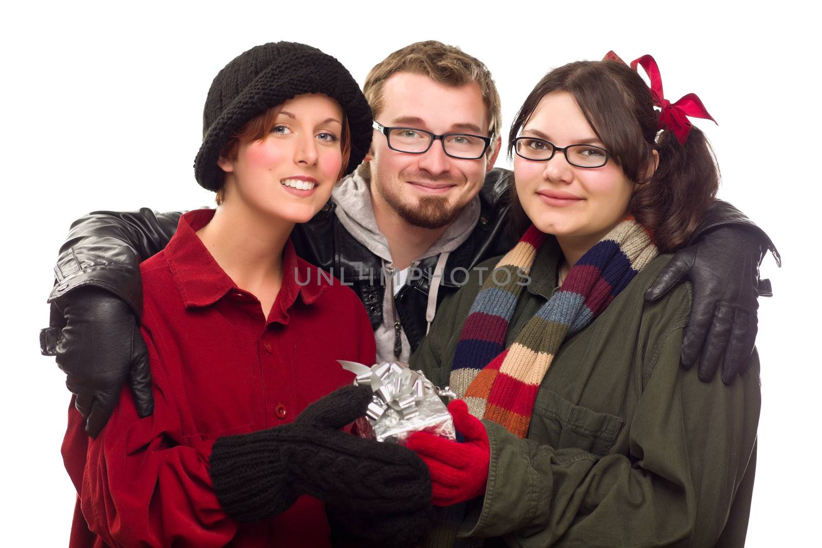 Three Friends Holding A Holiday Gift Isolated on a White Background.