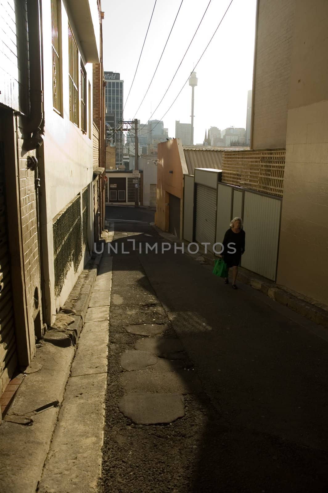 sydney suburb street near kings cross, unrecognizable woman in black