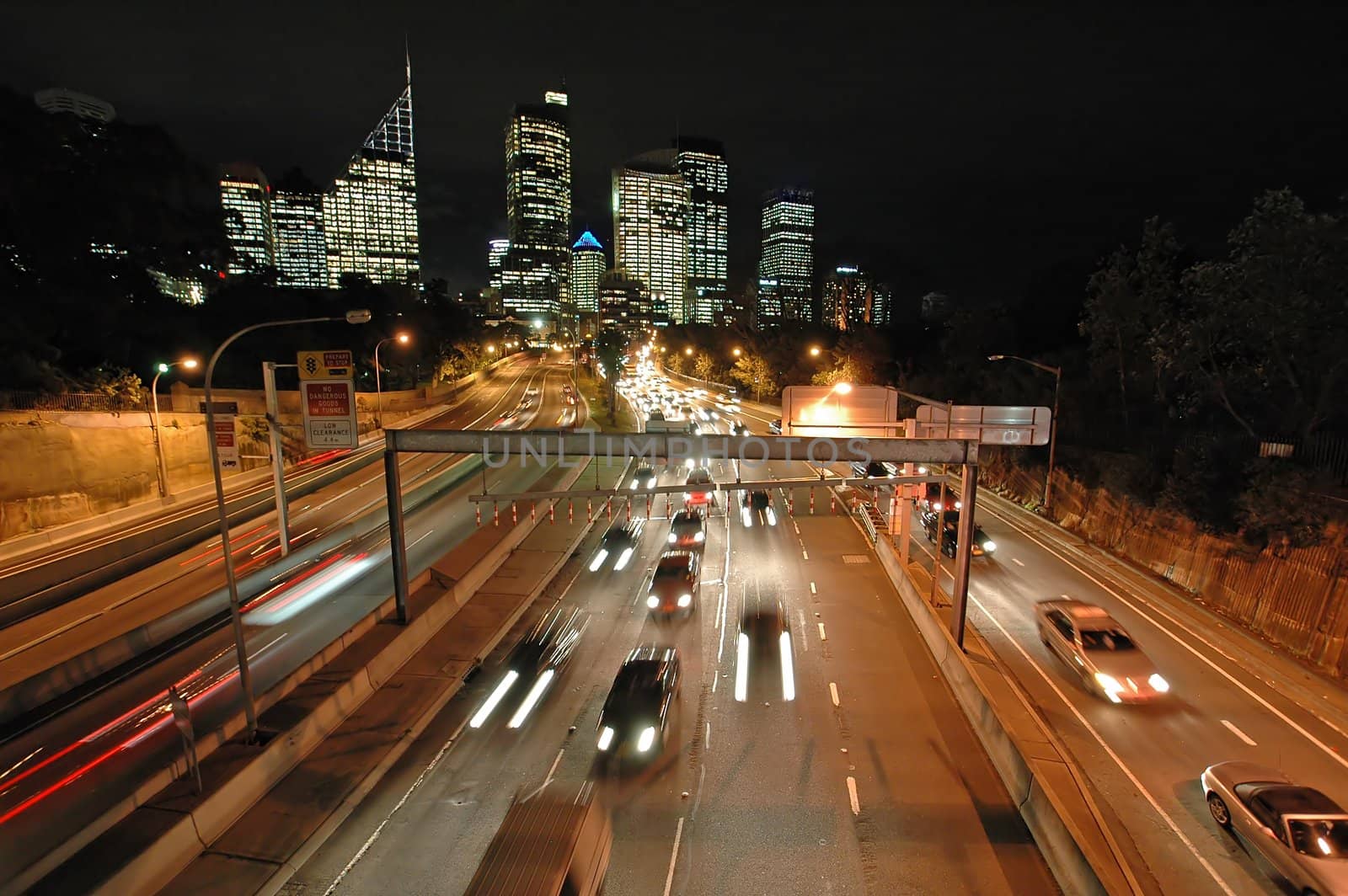 expressway in sydney, night traffic, CBD in background, blurred cars