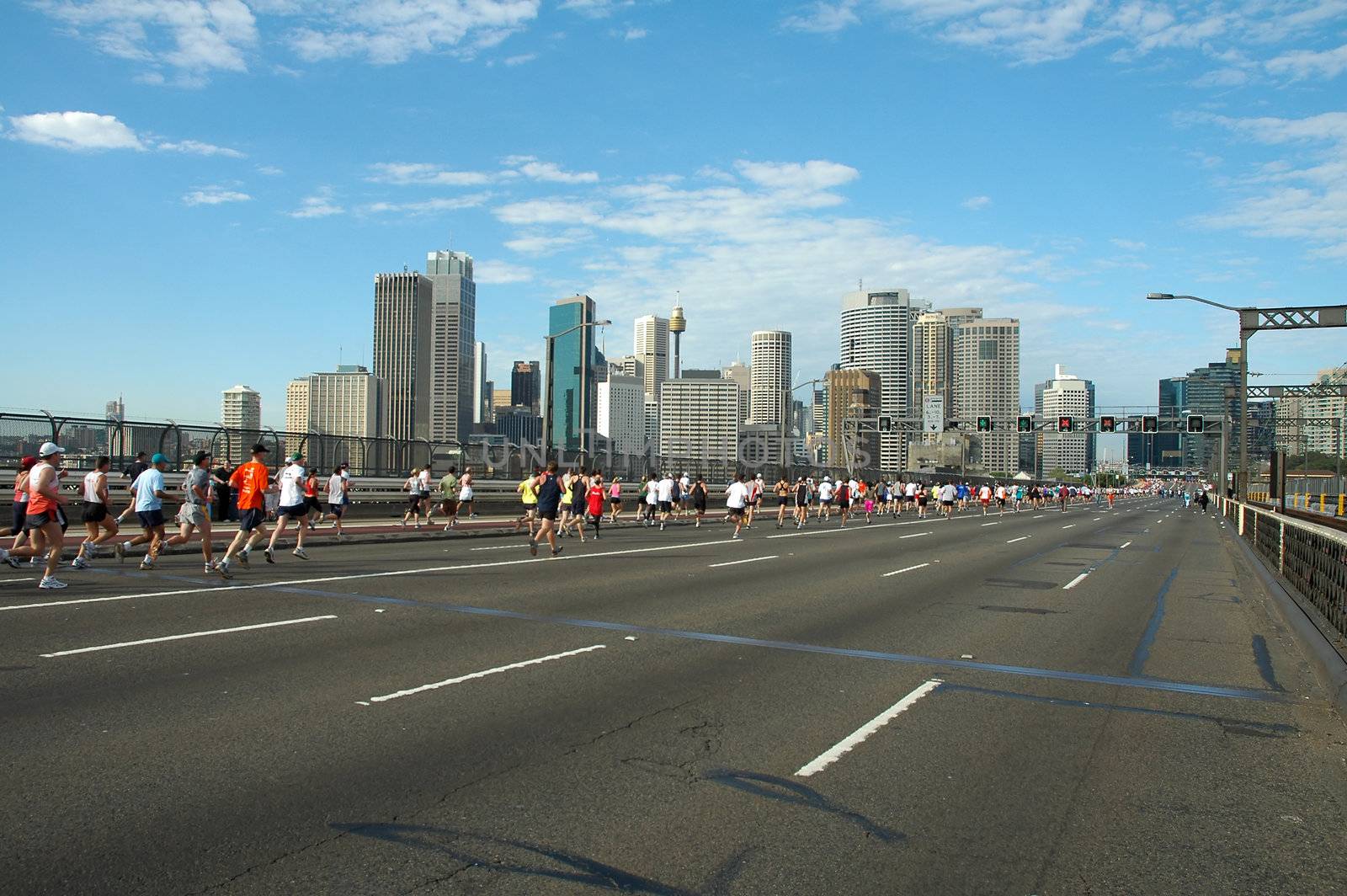 sydney marathon, runners just passed harbour bridge and are running to sydney cbd