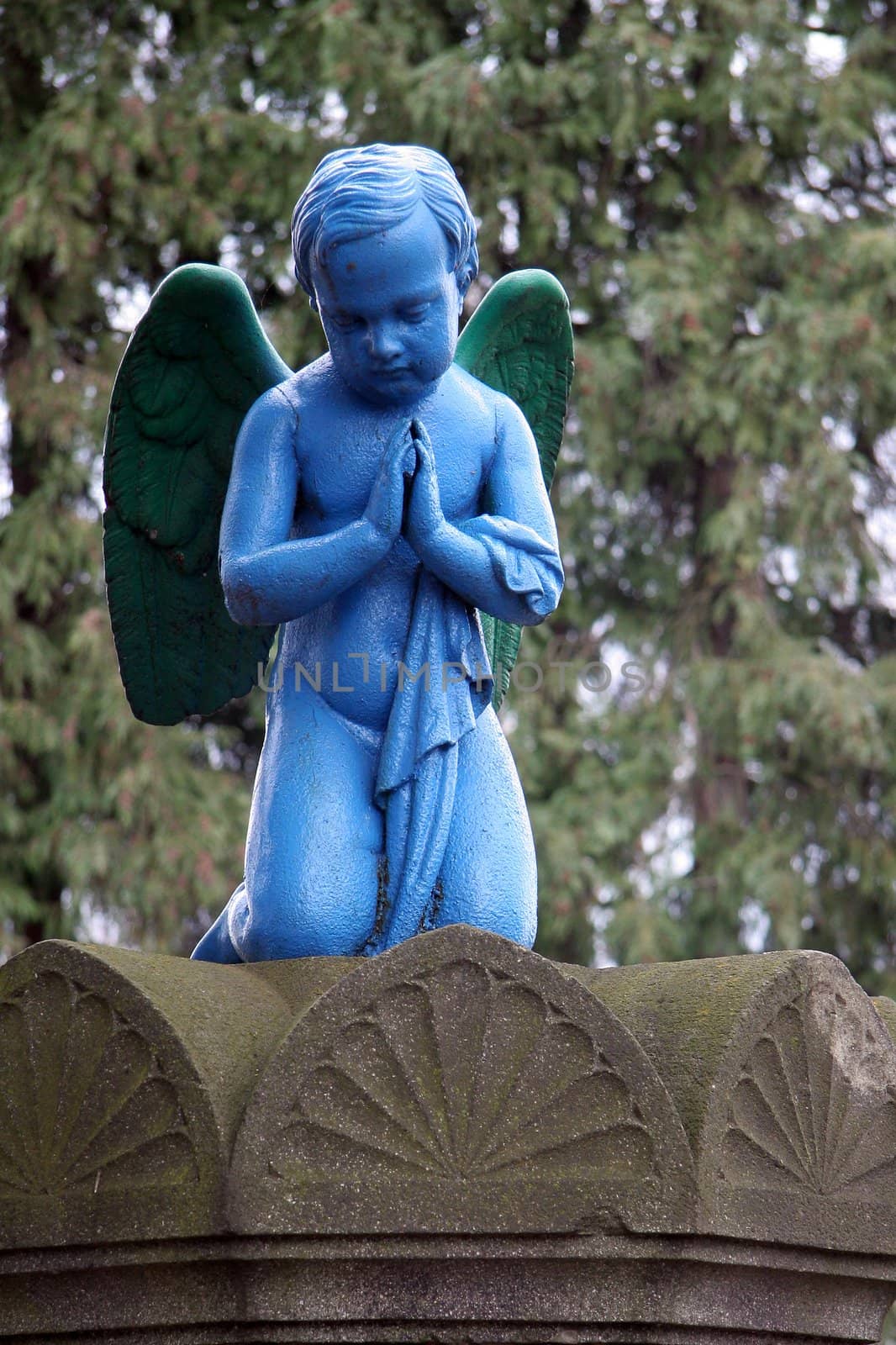 blue praying angel, photo taken at Slovakian cemetery