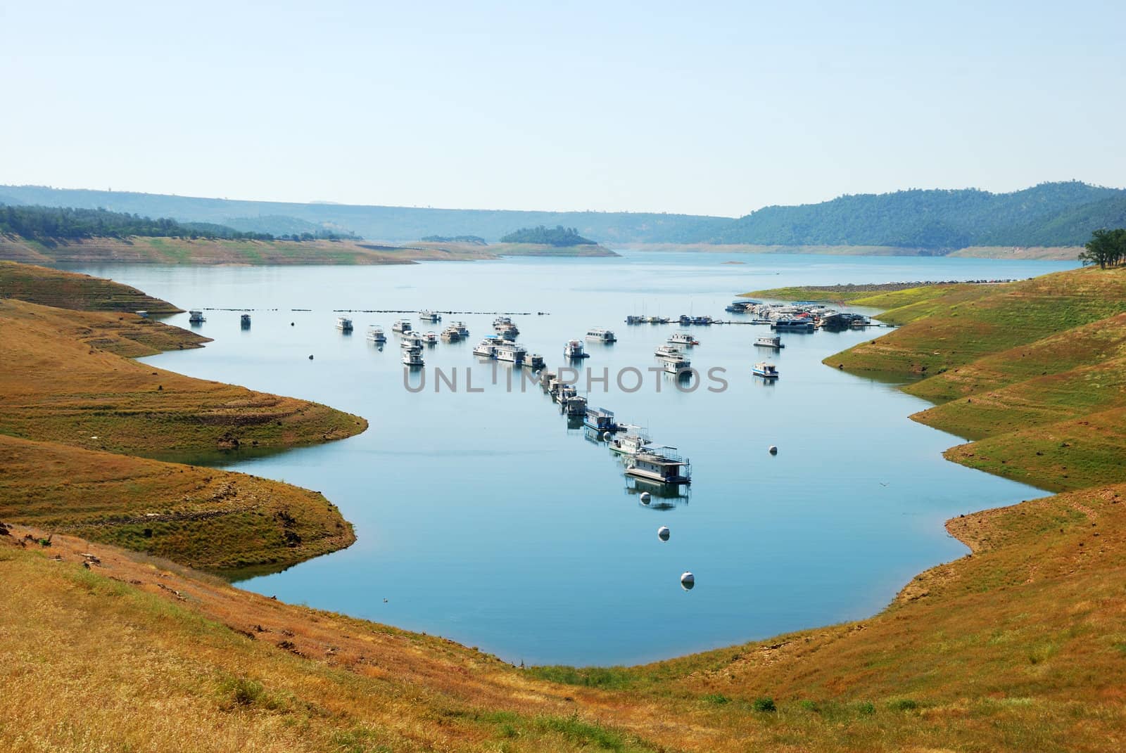 A line of houseboats on the New Melones Lake in California.