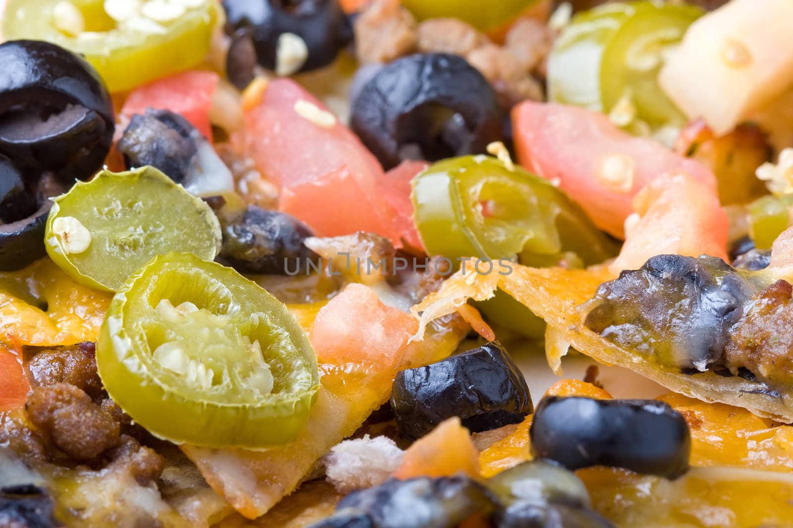 plate of nachos shot close up nice detail of the freshly cooked vegetables