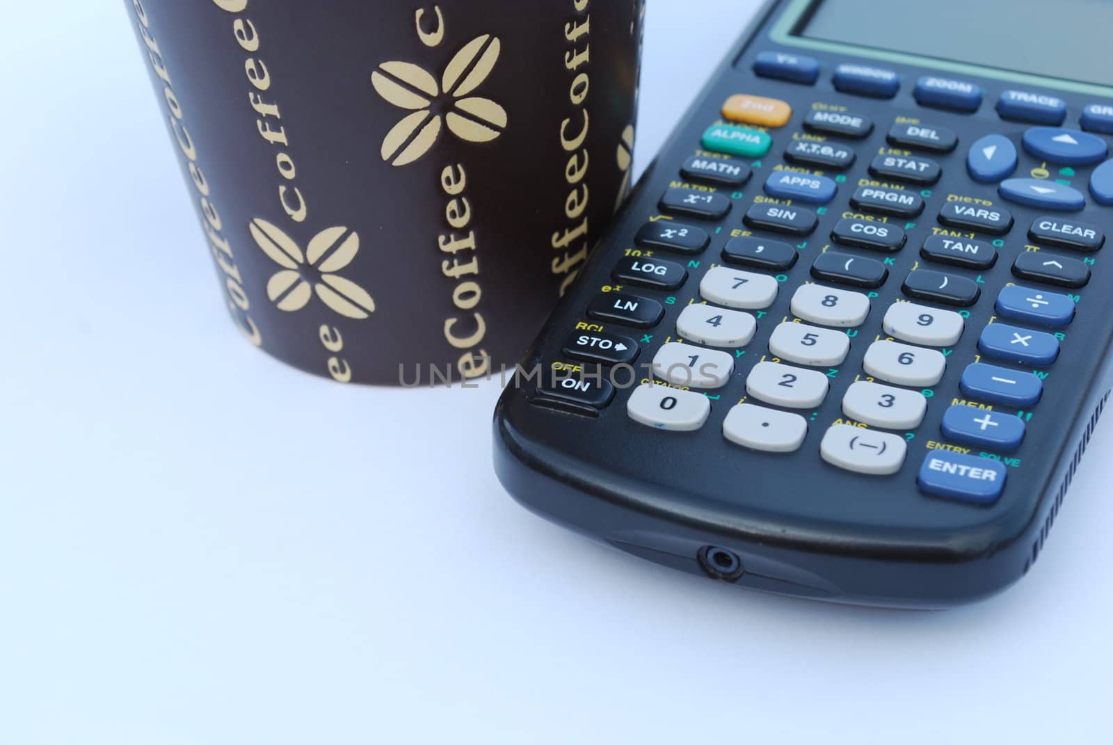 concept photo of a coffee mug and calculator