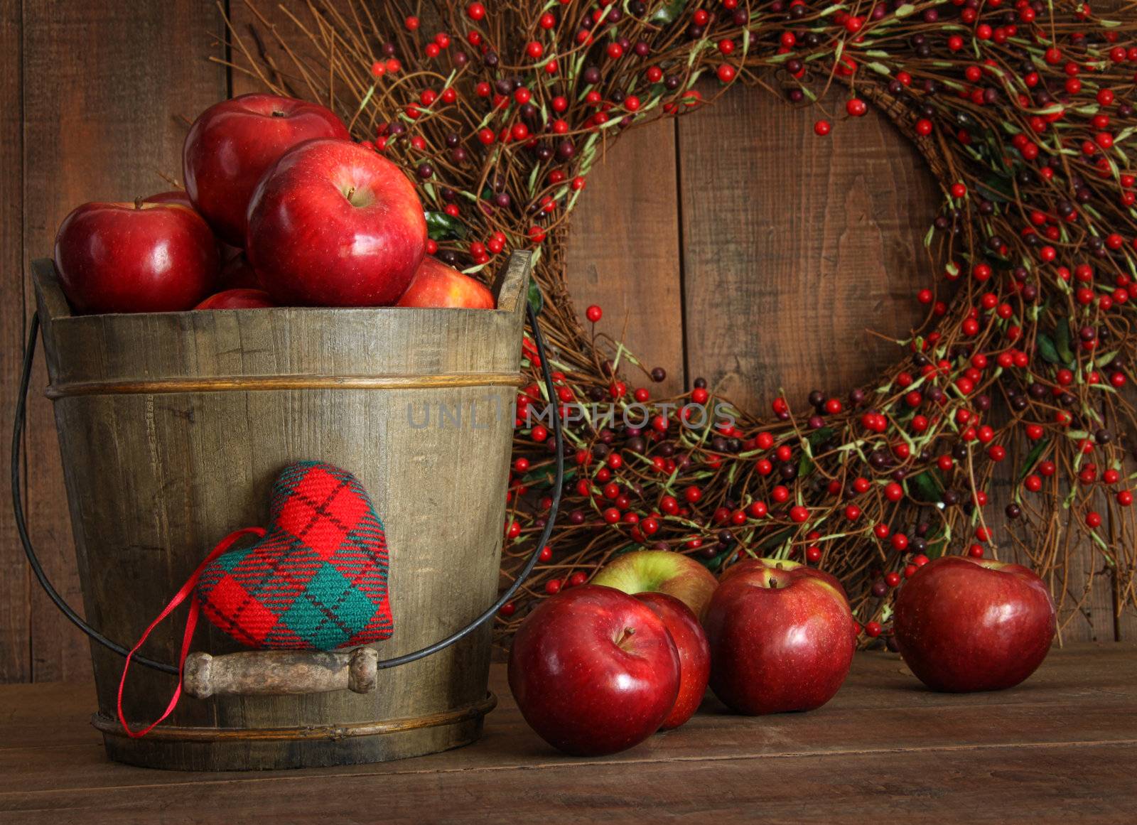 Red apples in wood bucket for holiday baking