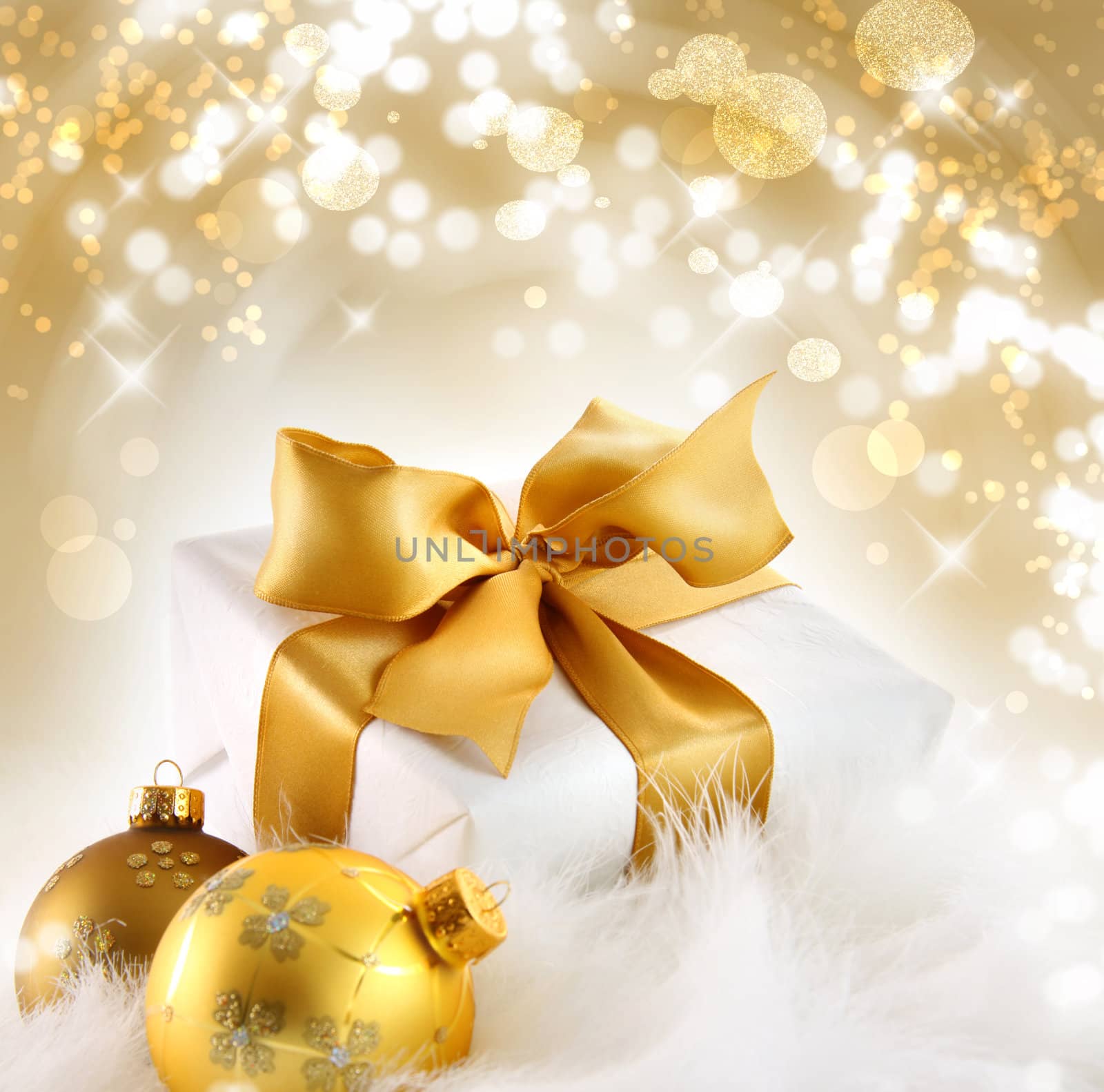 Gold ribboned gift with holiday background by Sandralise