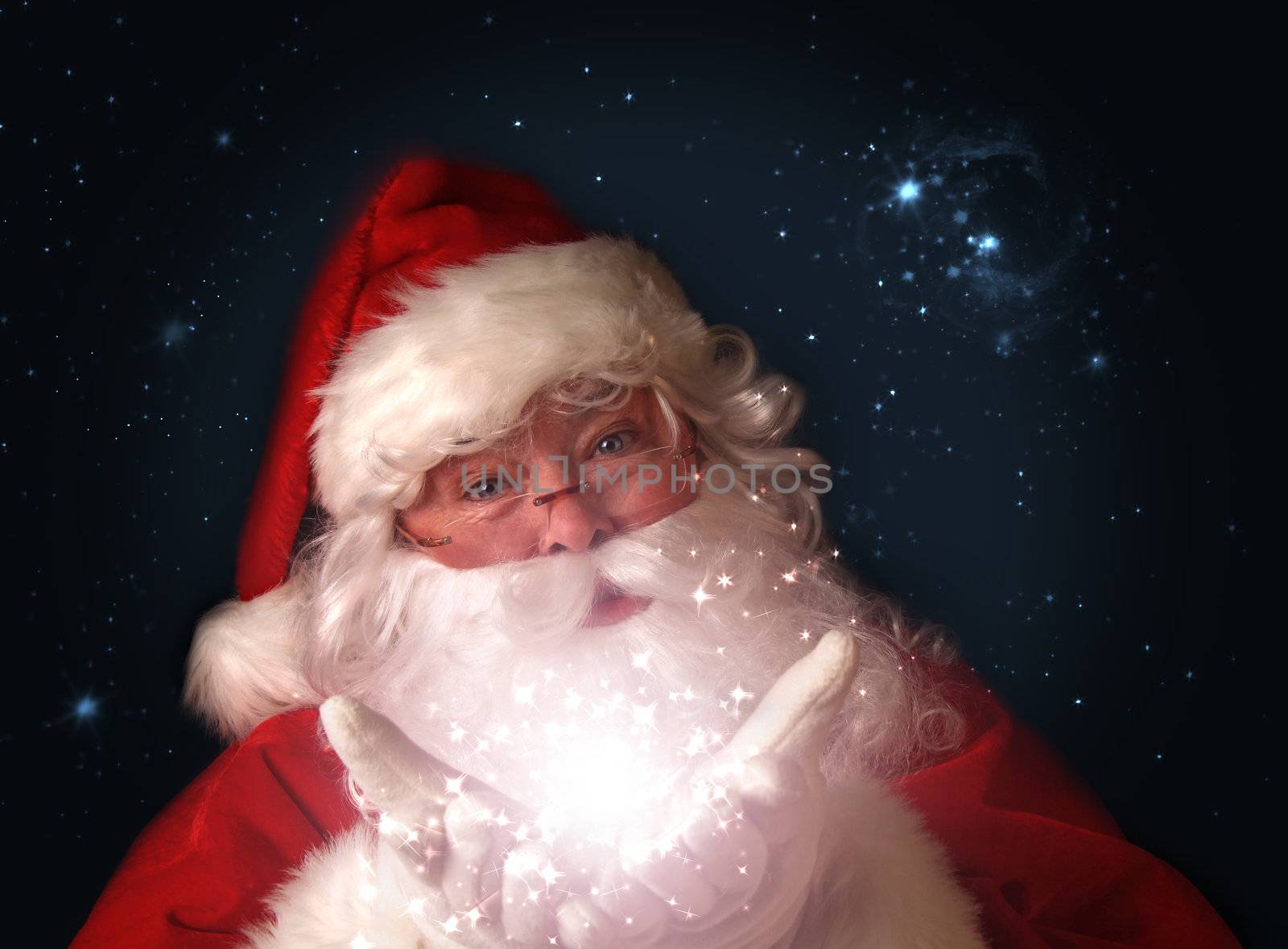 Santa holding magical christmas lights in hands by Sandralise