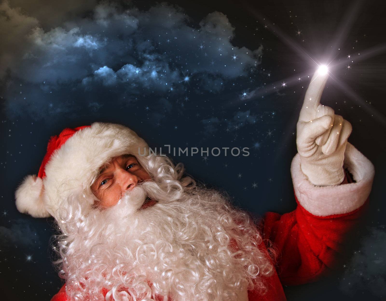 Santa pointing with magical light to the sky
