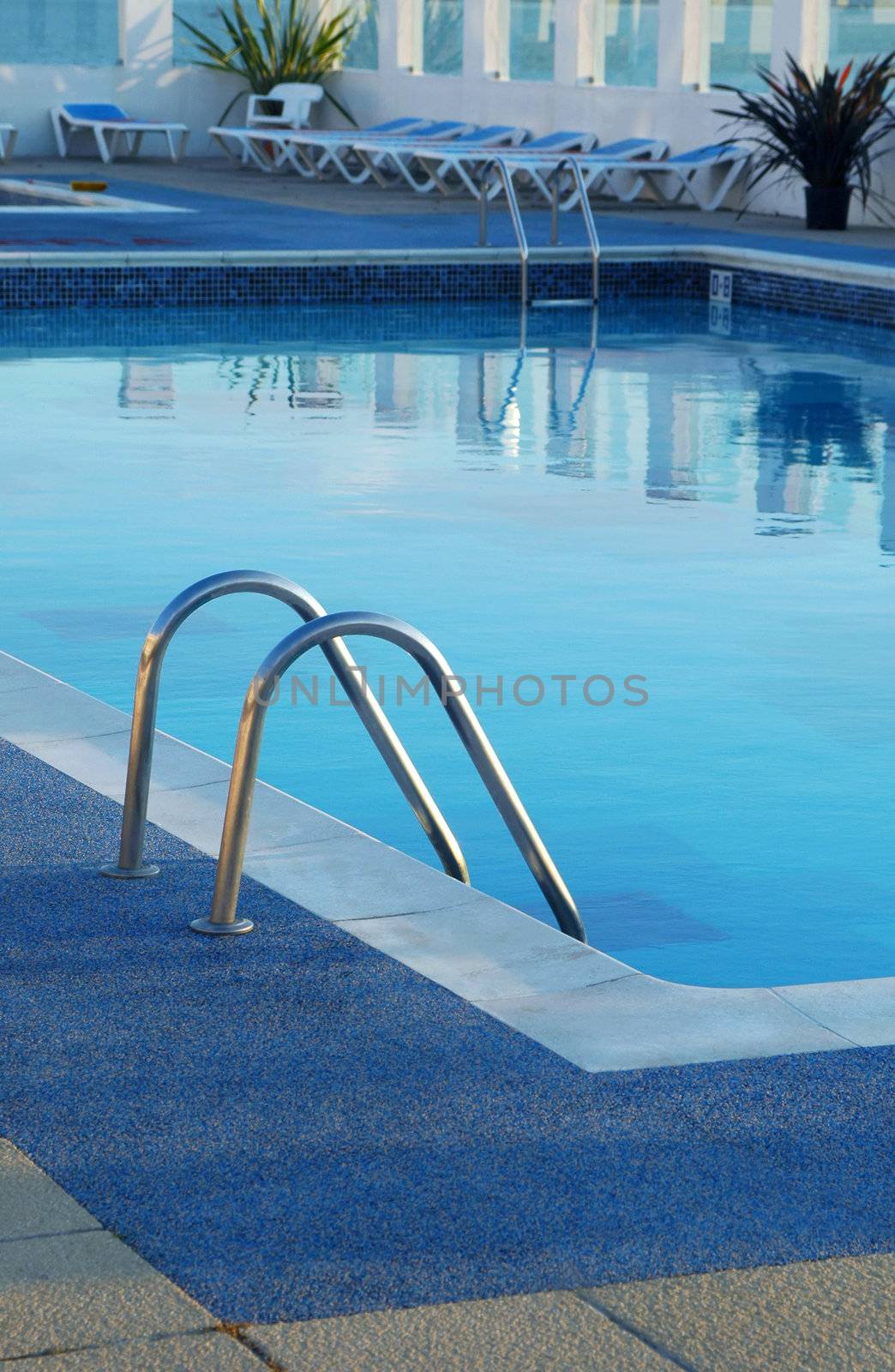 empty resort swimming pool at evening time