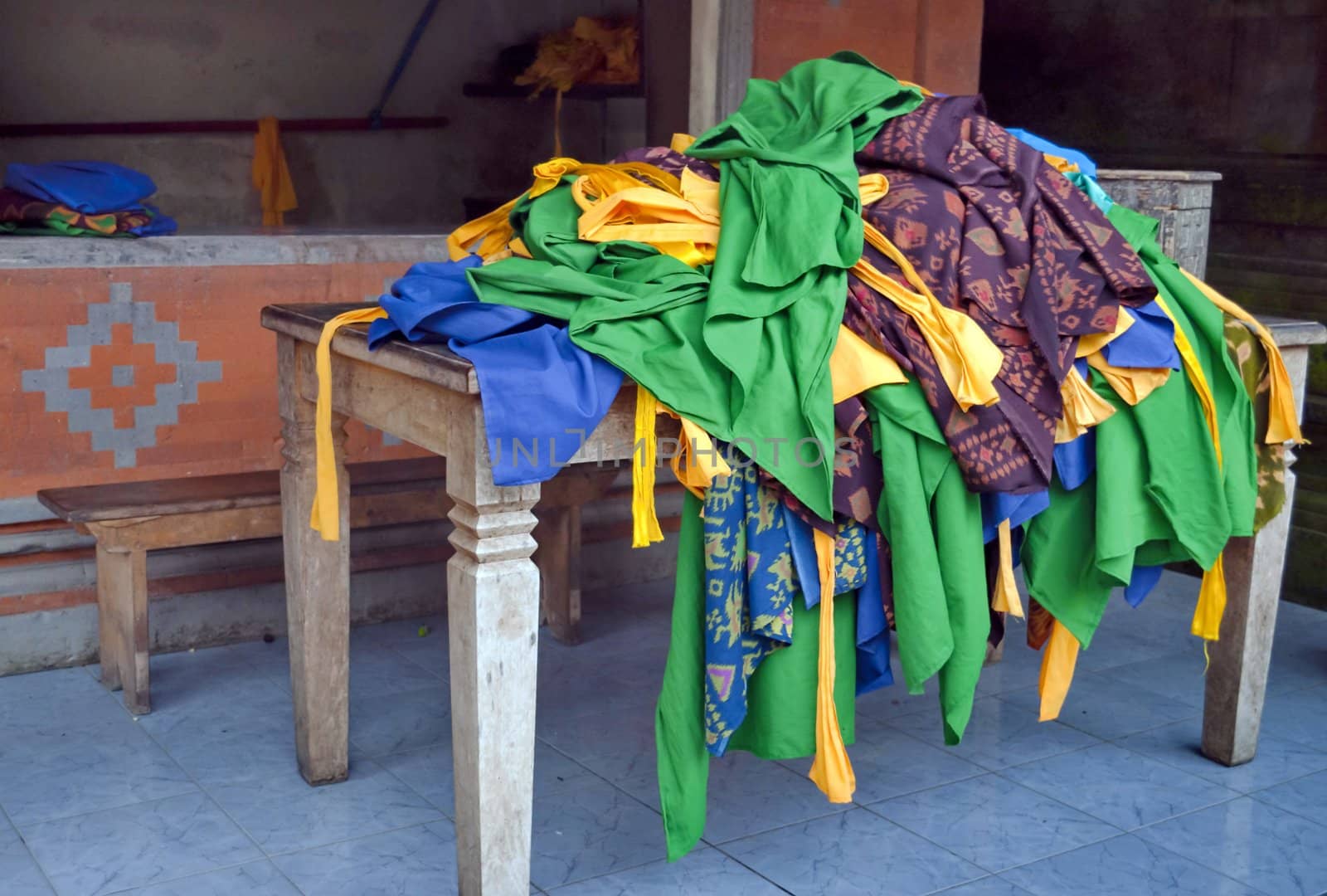 Hindu colorfull ceremony cloths pile over a table