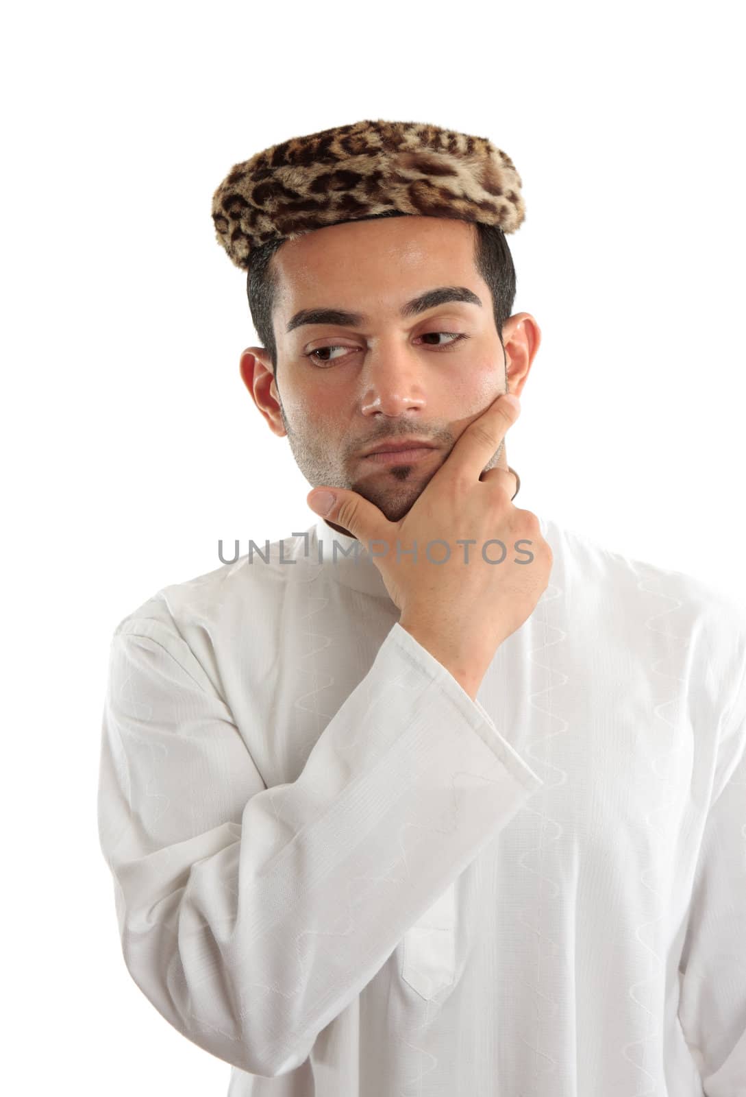 Deep thinking man with one hand on chin.  Looking down and sideways - space for copy.  White background.