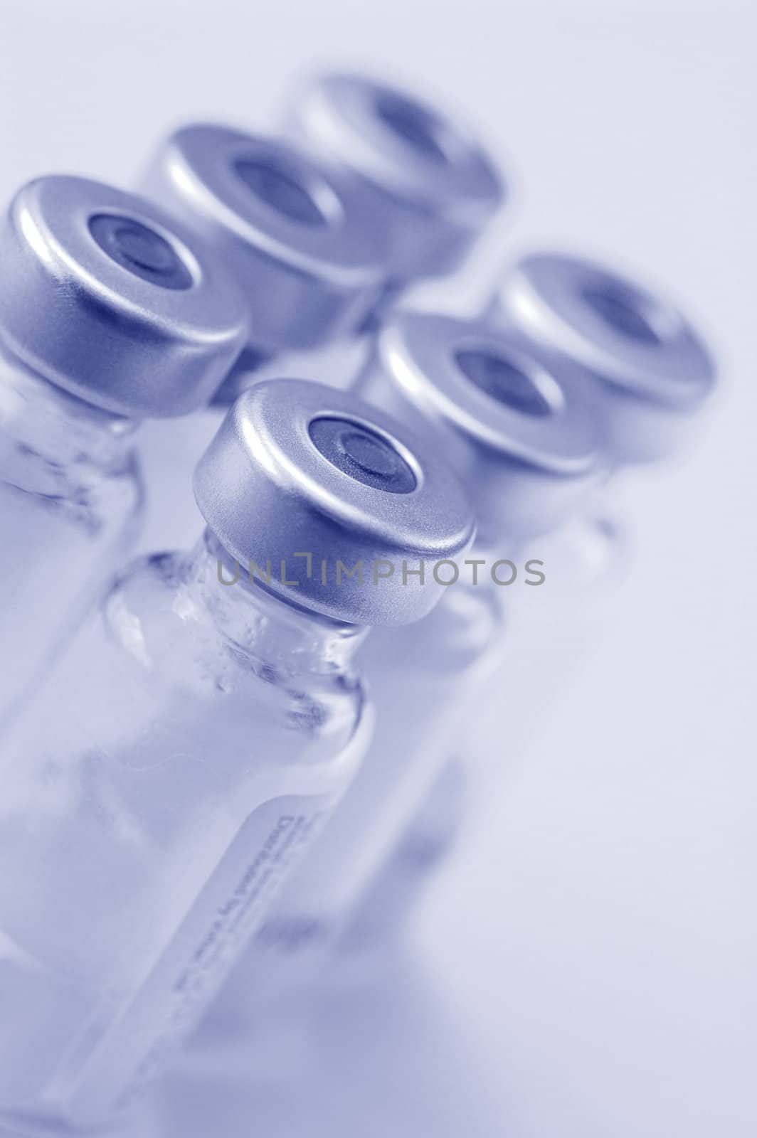 glass vaccine bottles close-up