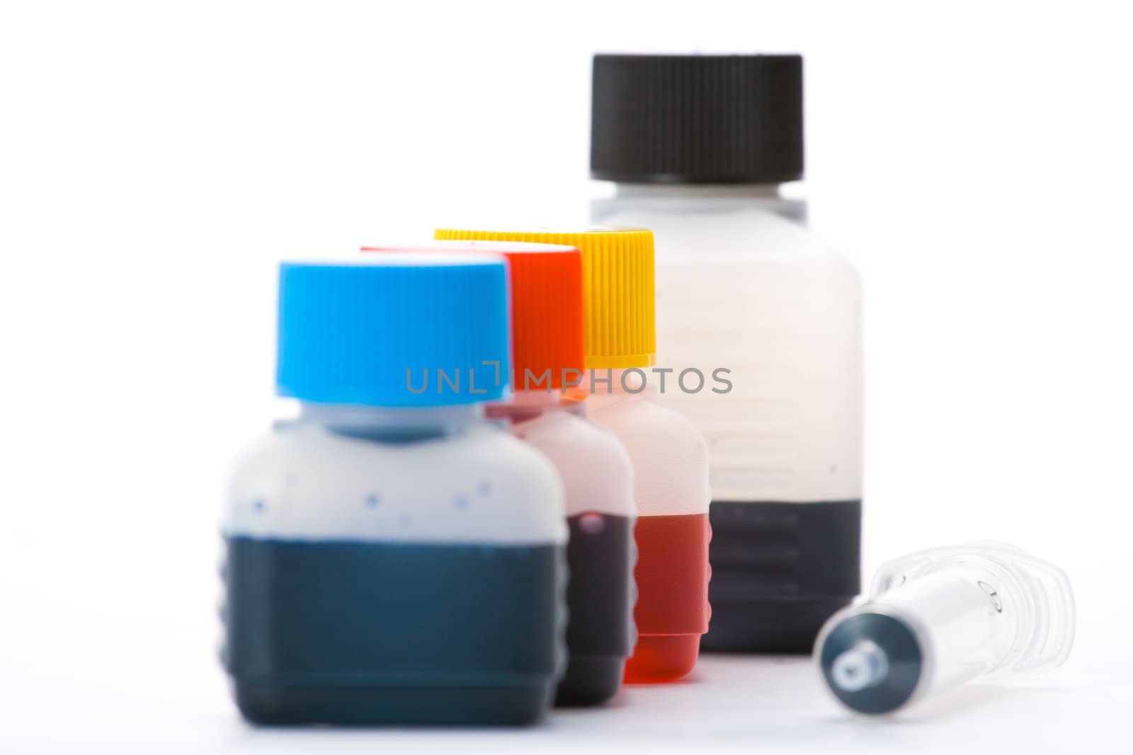 CYMK ink bottles isolated over white background.