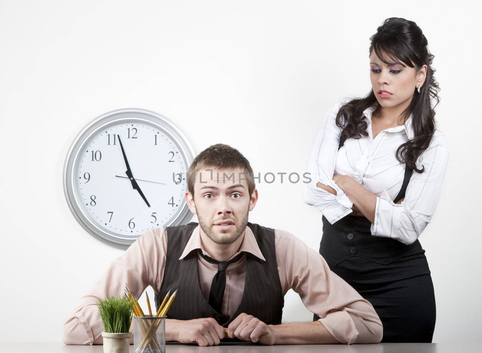 Woman at work wngry with male coworker