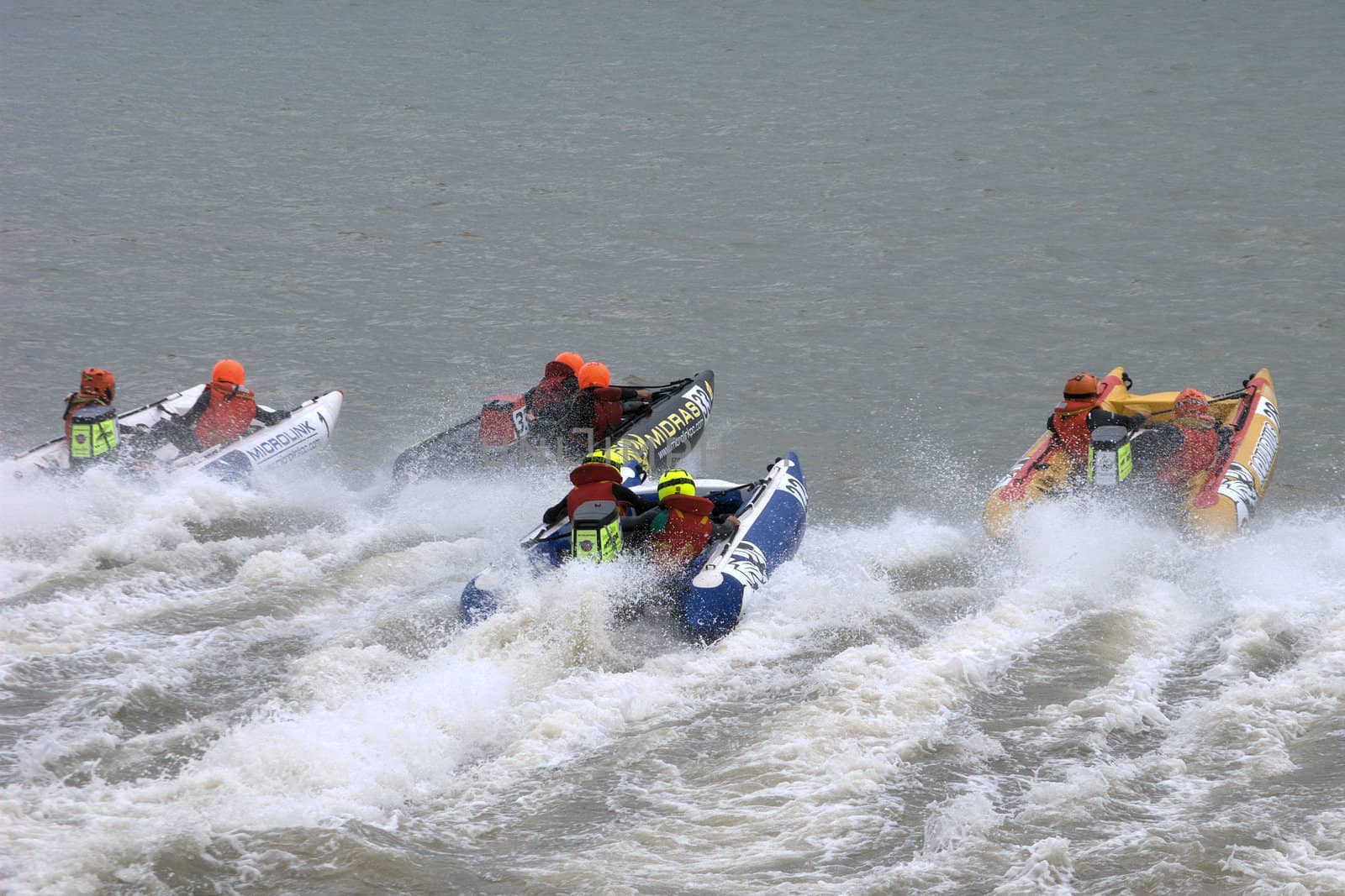 Group of inflatable power boats racing